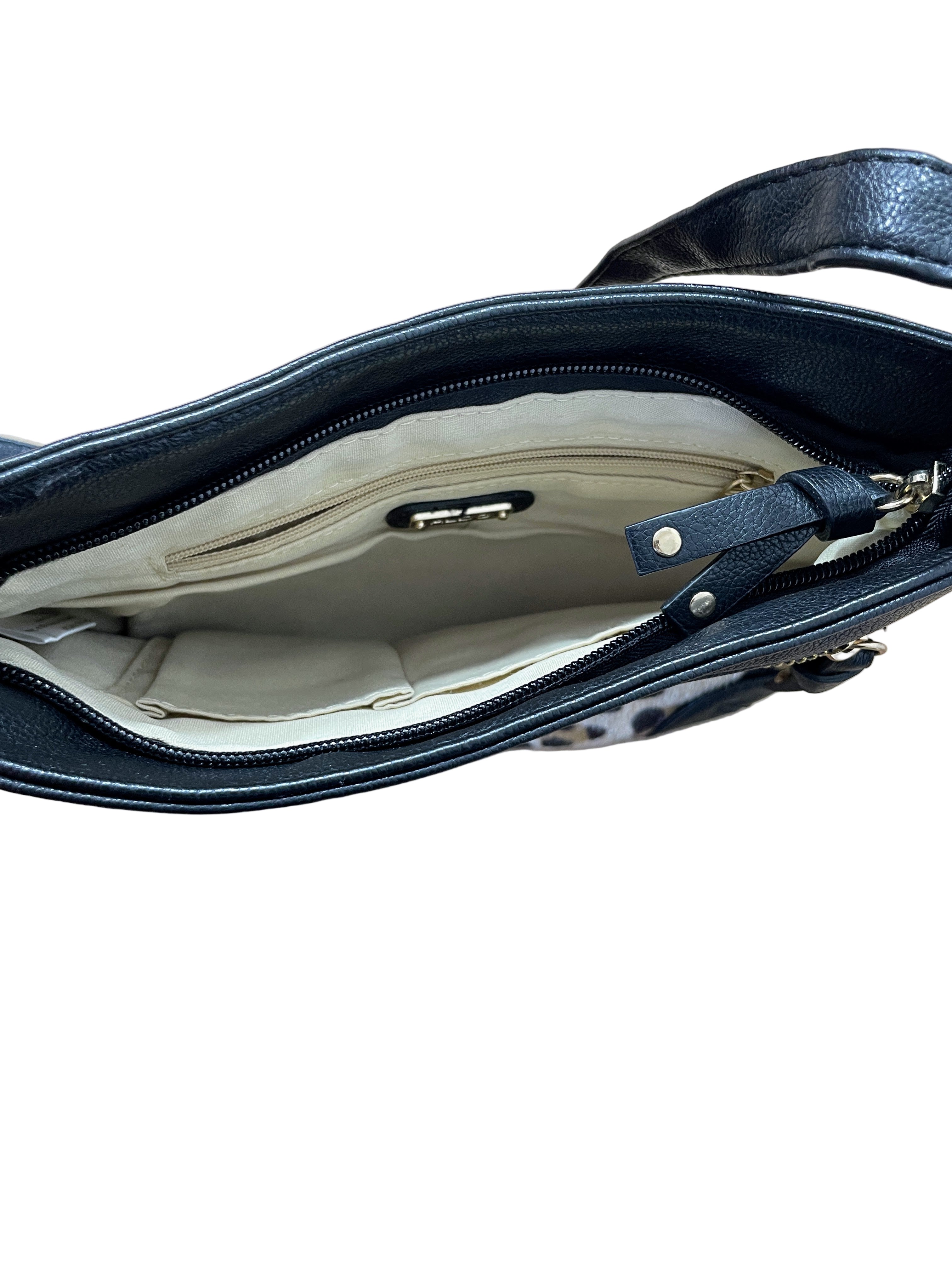 Interior of Aldo crossbody purse showing cream lining and compartments