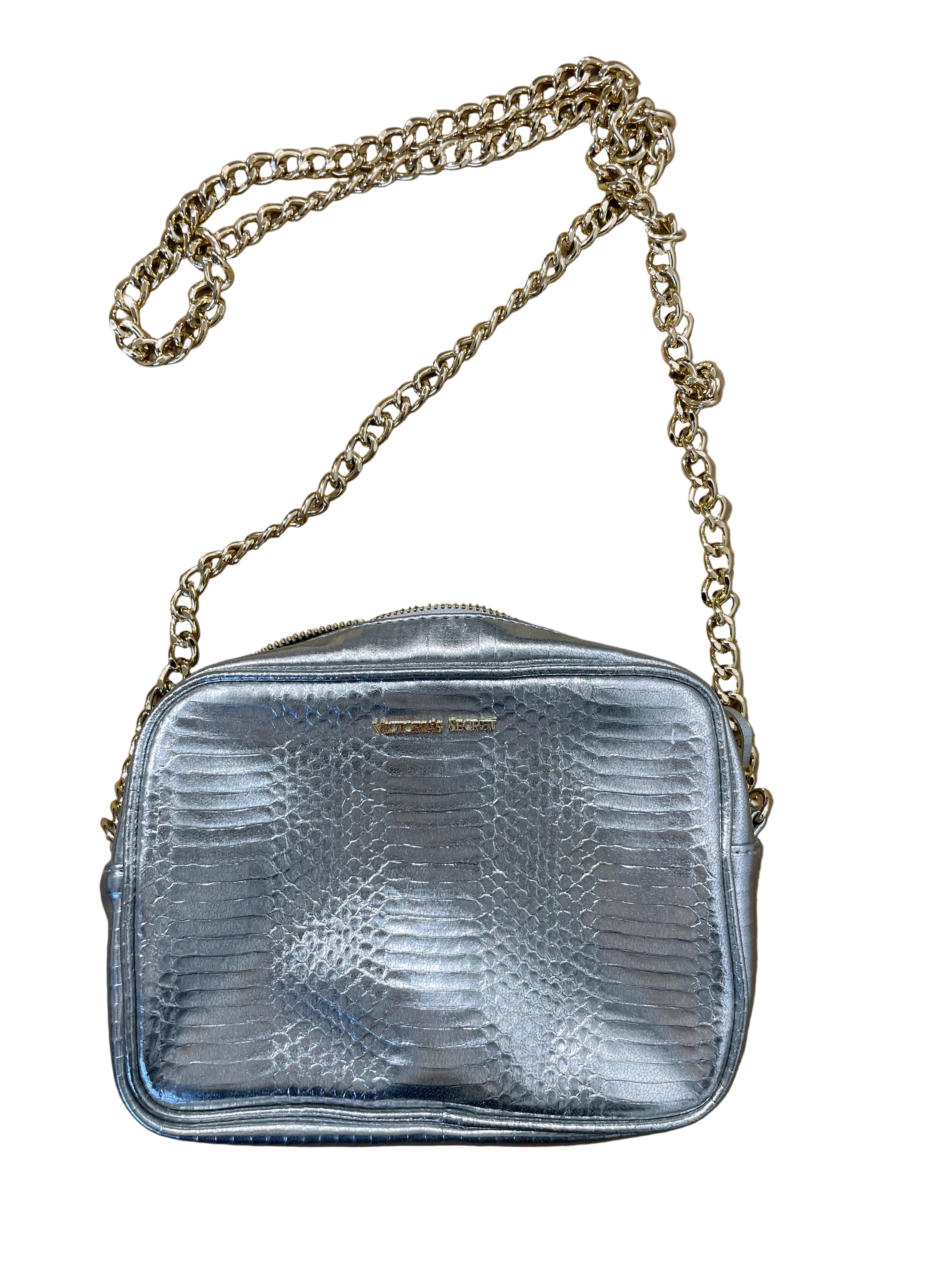 Front view of Victoria’s Secret silver crossbody bag with logo and gold chain strap