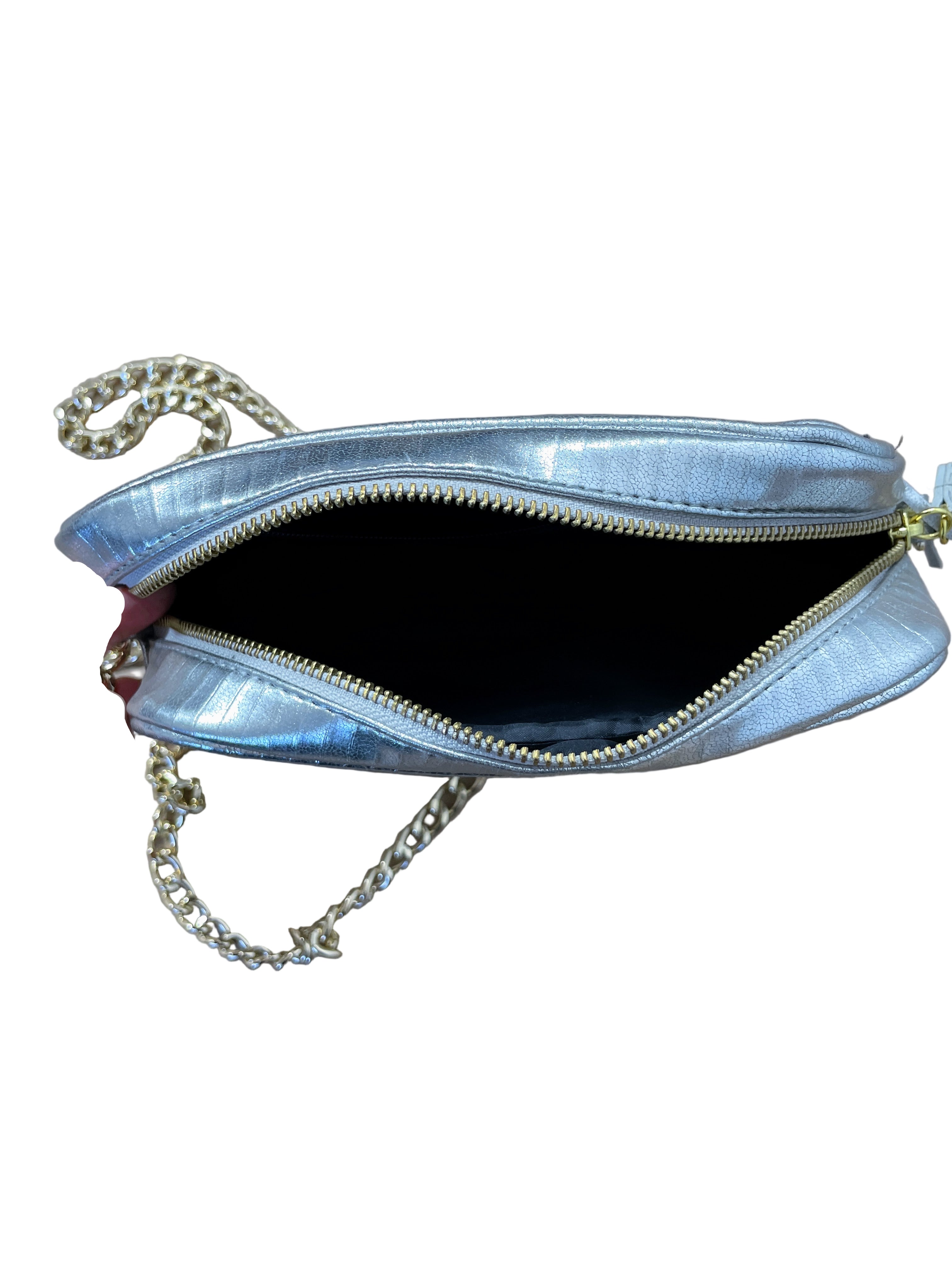 Open view of Victoria’s Secret silver crossbody showing zipper opening and chain strap