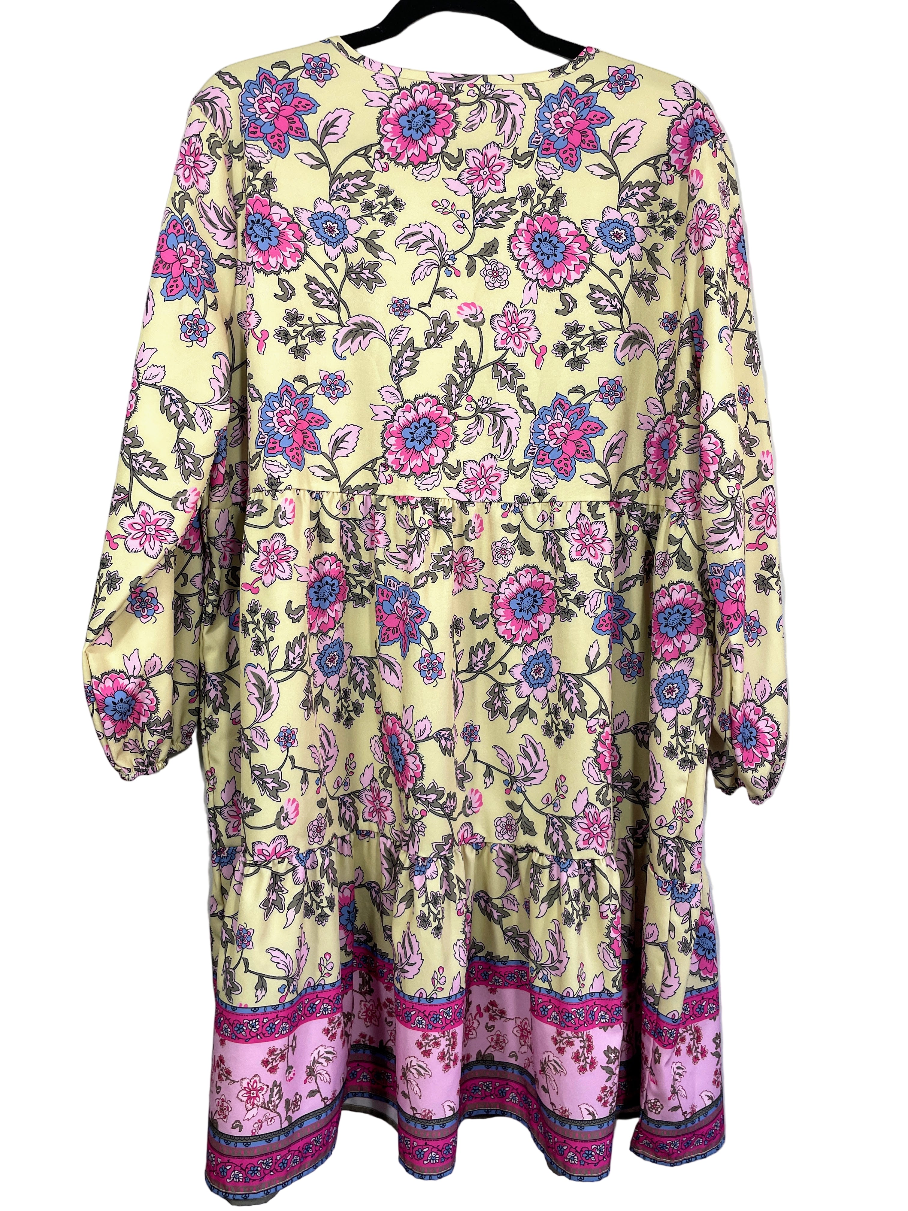 Back view of yellow floral boho dress with long sleeves