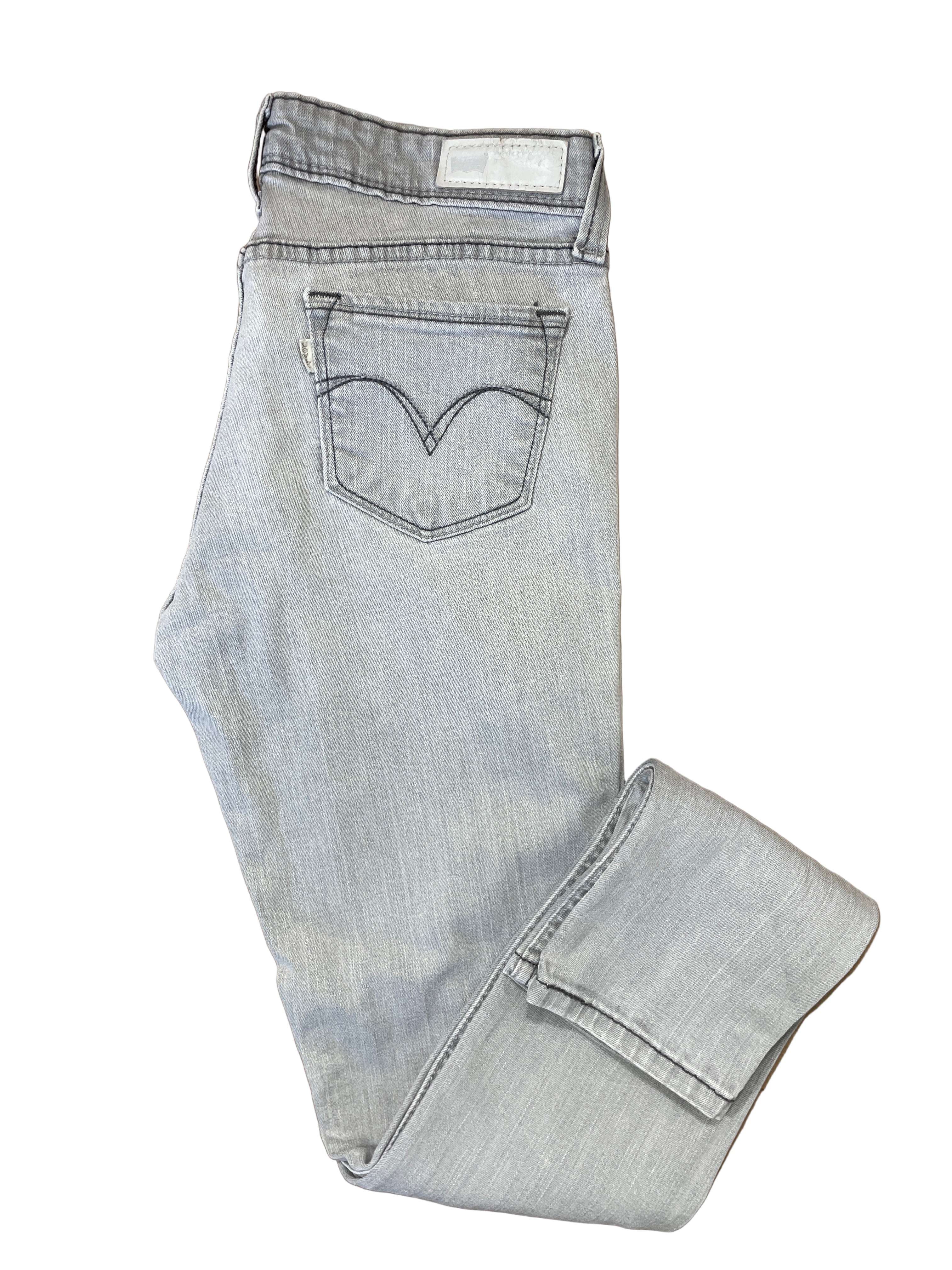 Folded view of Levi’s Demi Curve low rise skinny jeans light wash size 7/28
