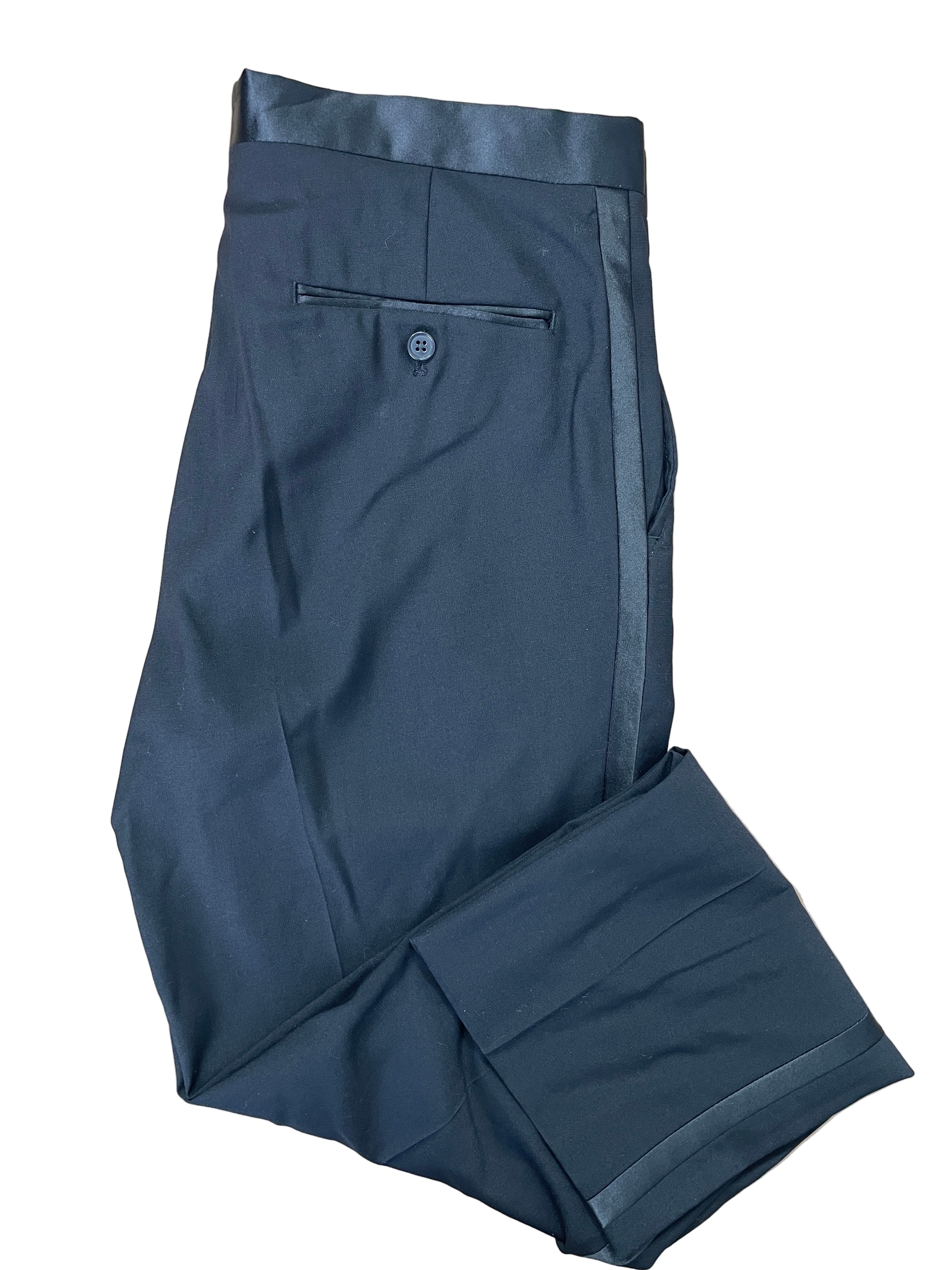Folded view of Moore’s black tuxedo pants with satin waistband and trim