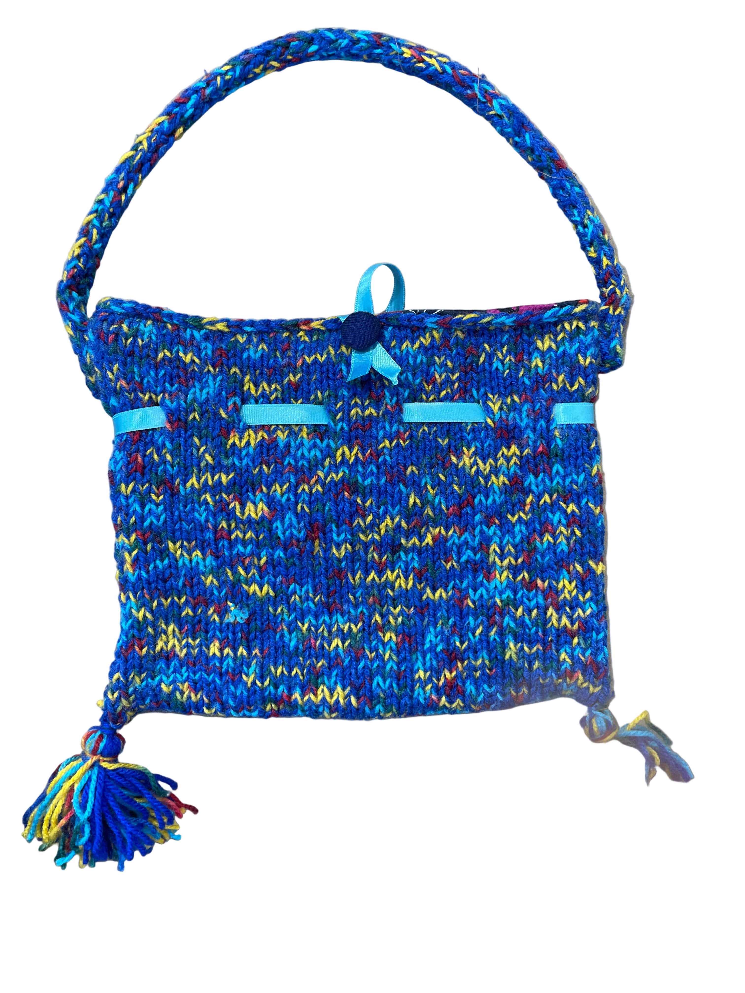 Handmade knit purse with multicoloured yarn and blue ribbon accents back view
