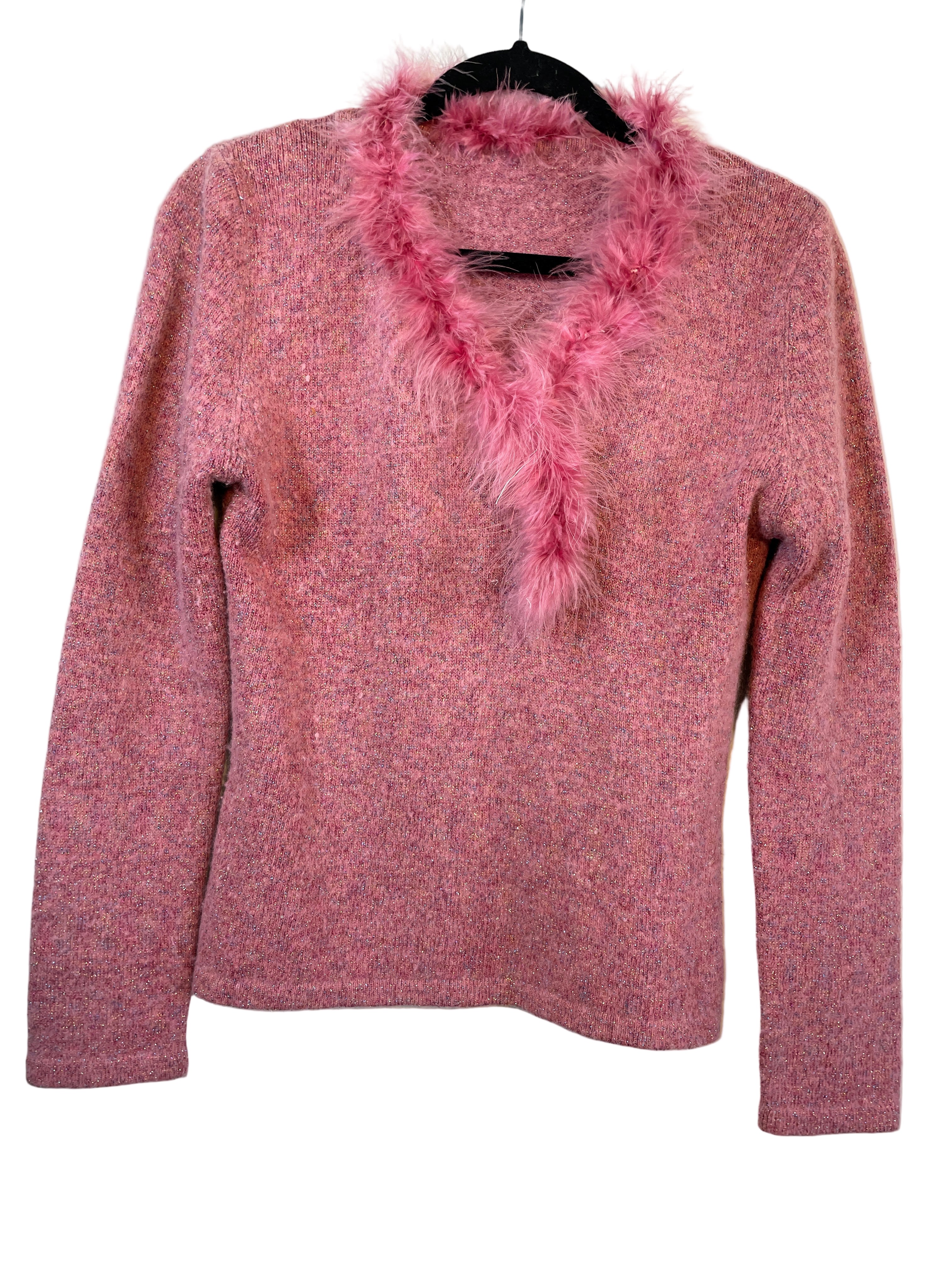 Front view of pink sparkly sweater with pink boa neckline forming a heart shape.