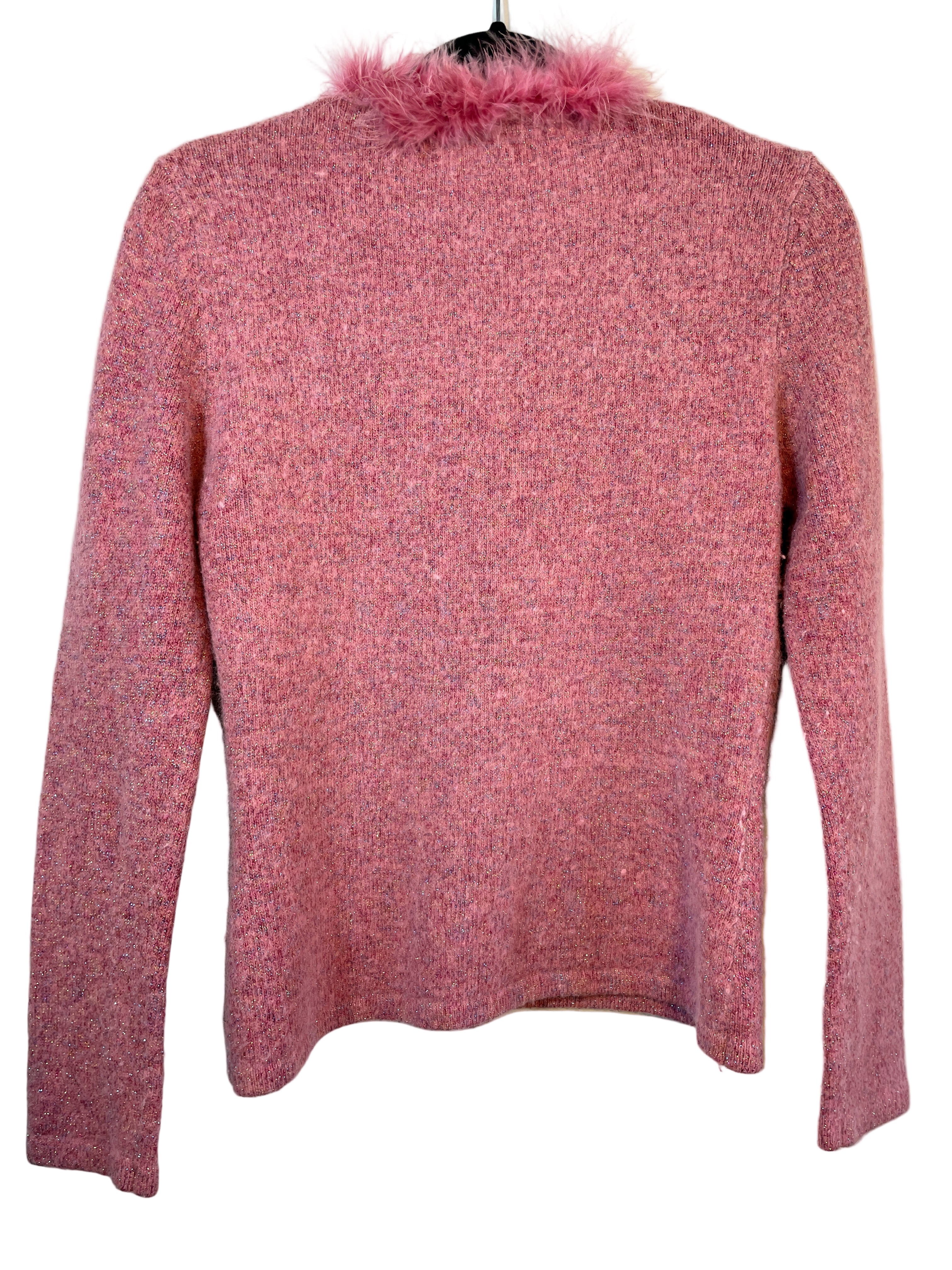 Back view of pink sparkly sweater showing plain design and long sleeves.