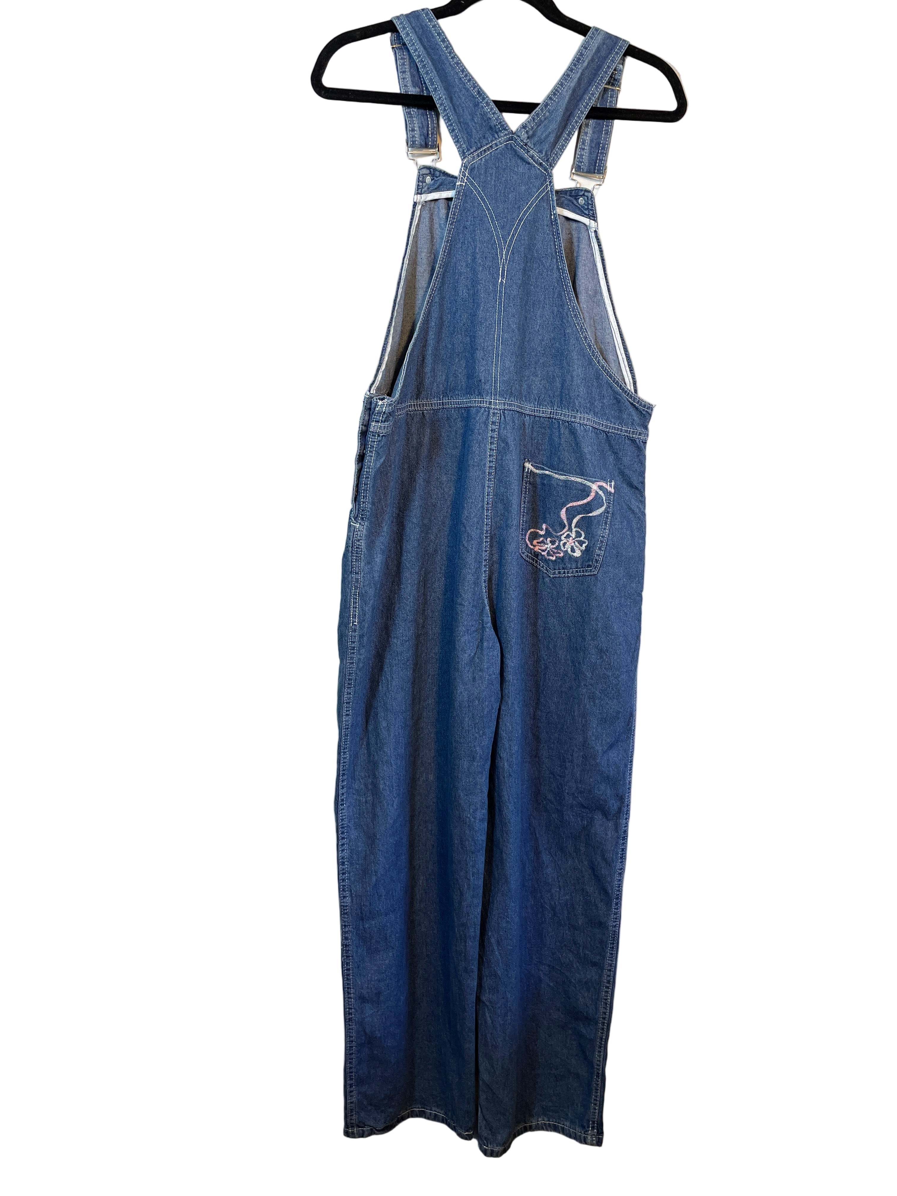 Back view showing cross-back straps and embroidered detail