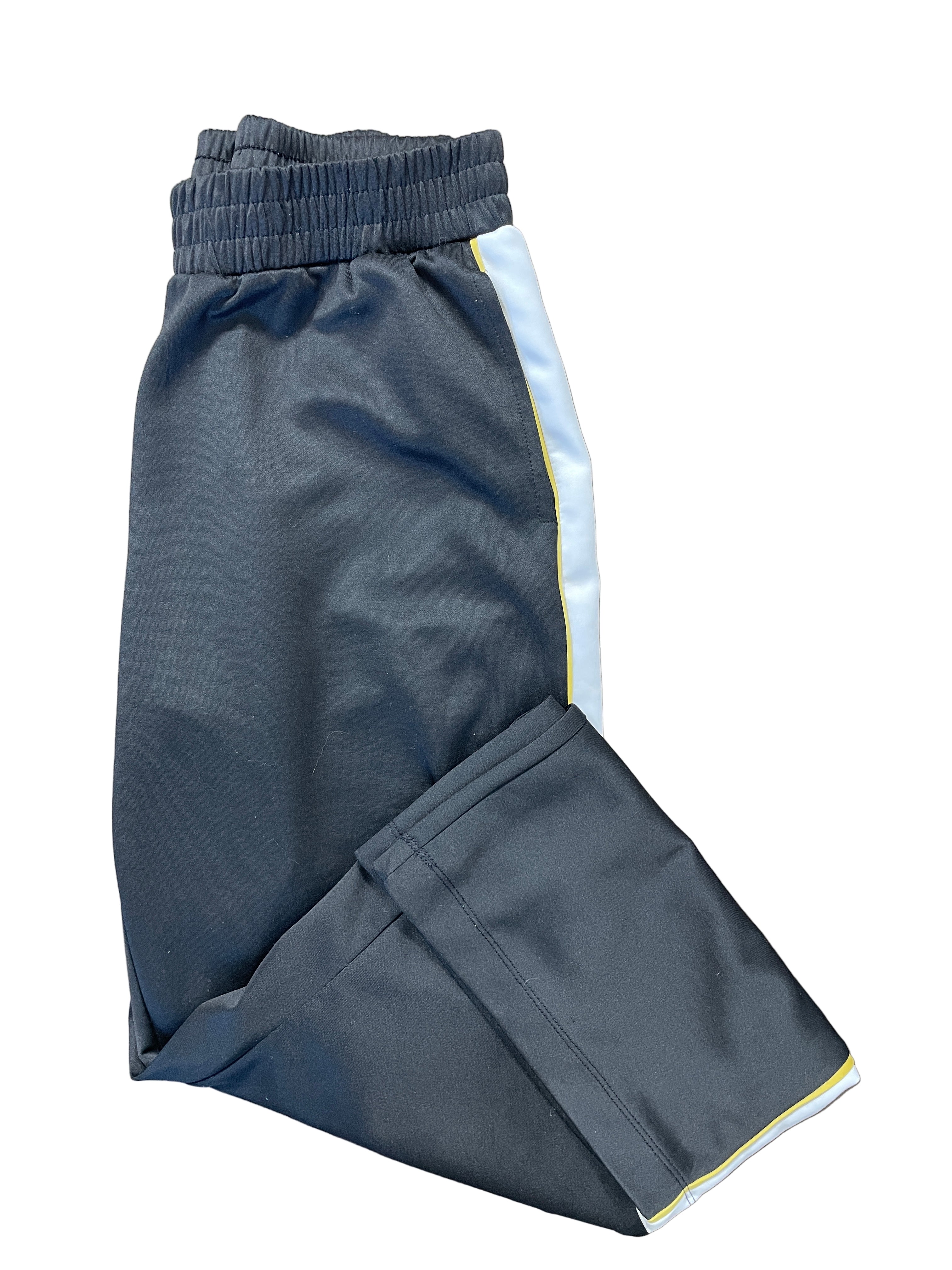 H&M Divided black wide-leg track pants folded showing white and yellow side stripe detail.