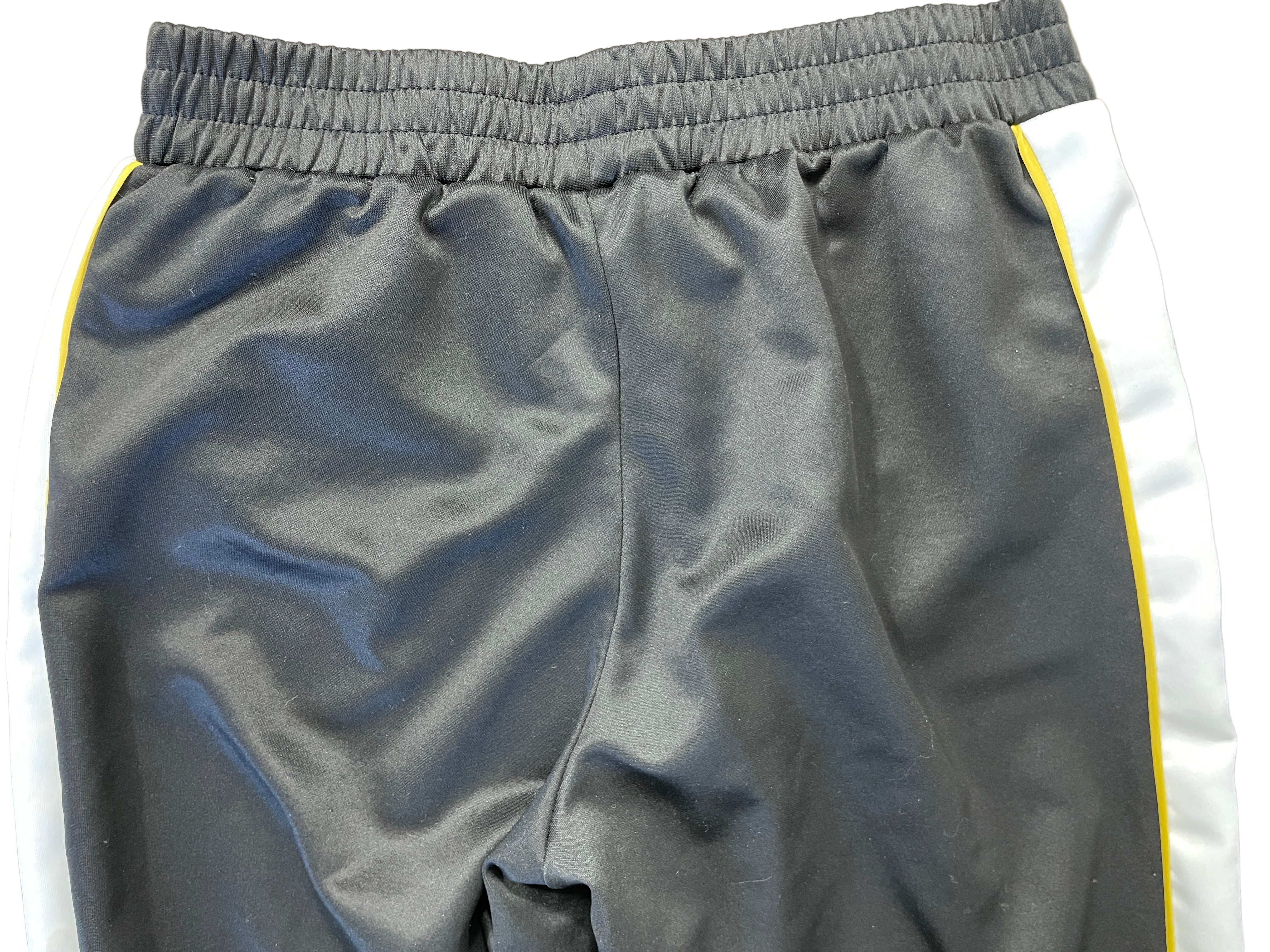 Back view of H&M Divided black track pants showing elastic waistband