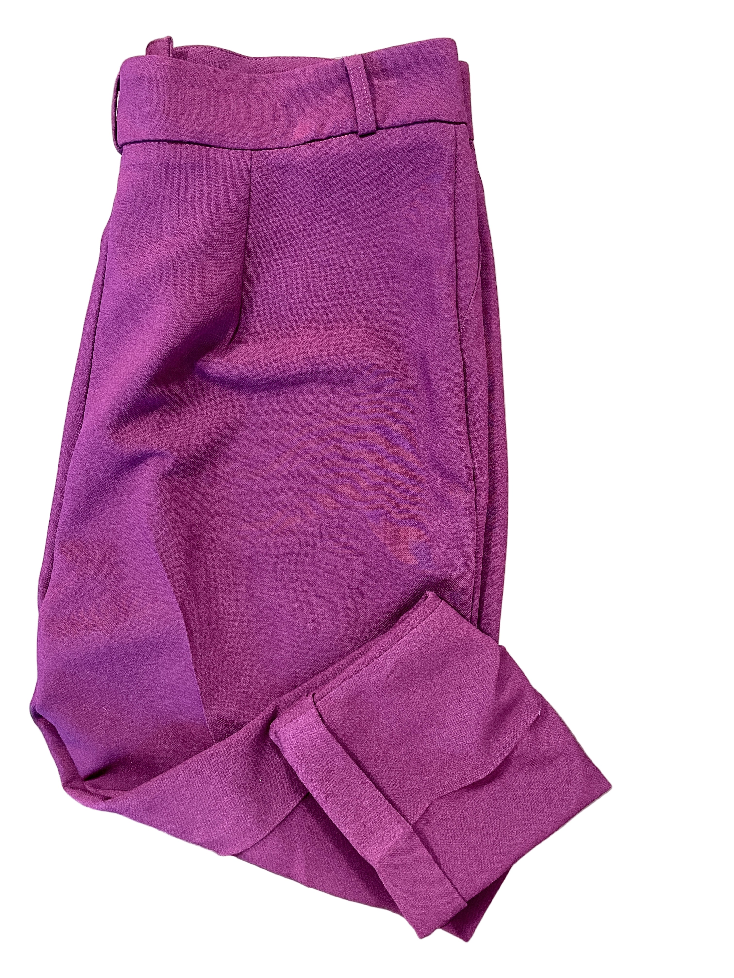 Le Château burgundy dress pants folded neatly showing colour and cuffed hems.