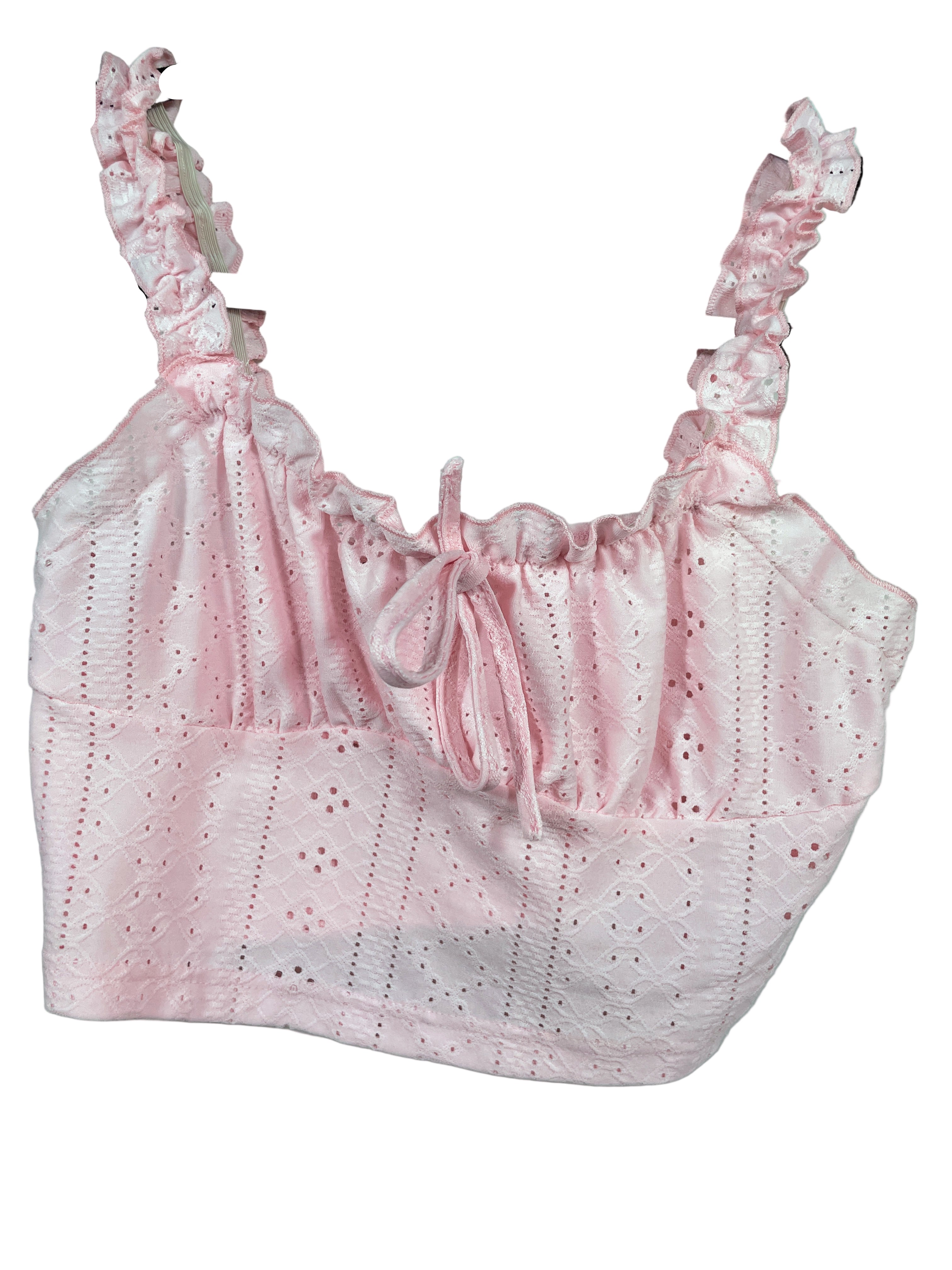 Pink lace top on a hanger against a light blue background