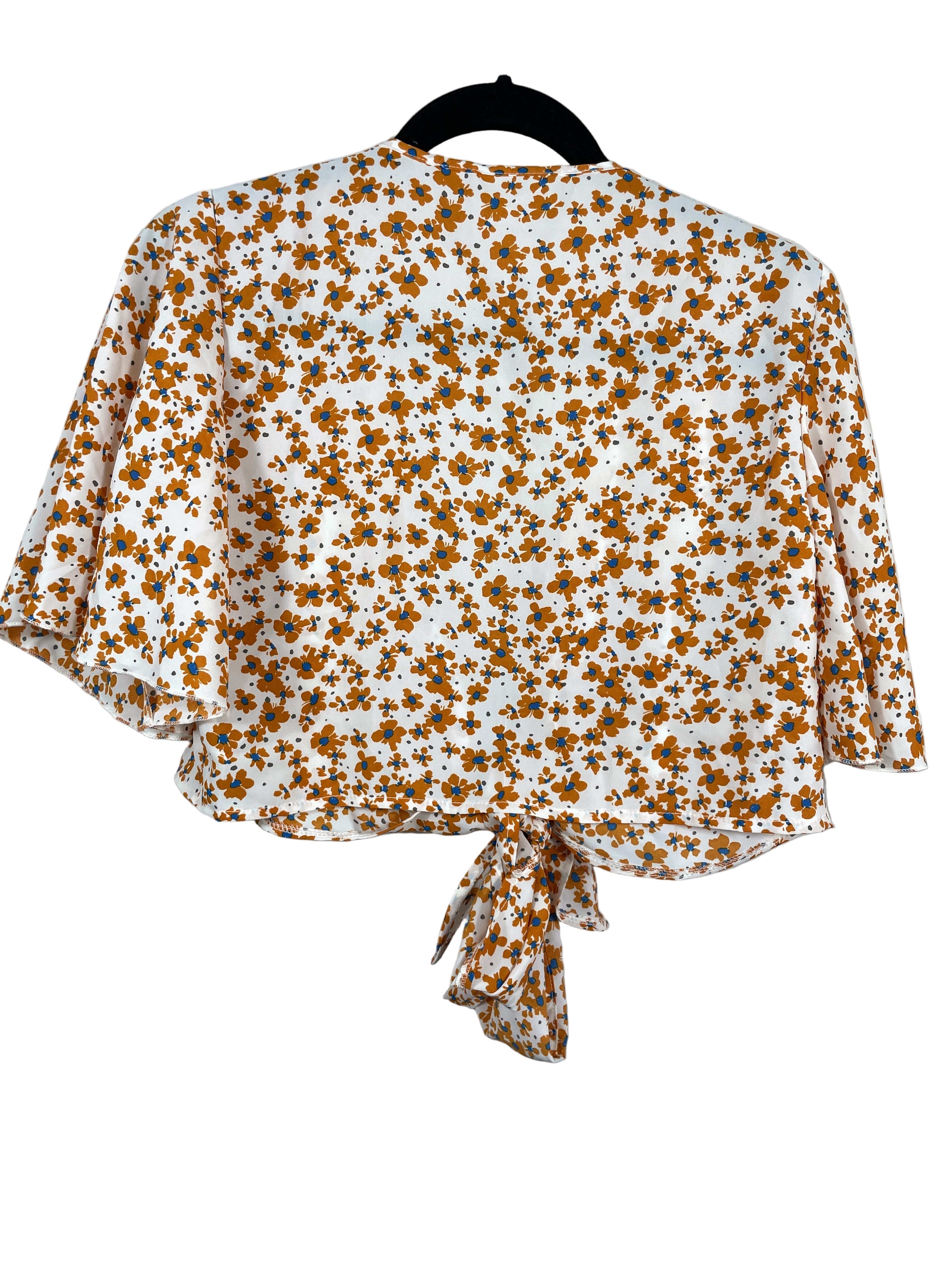 Back view of Joress floral blouse showing full floral pattern and tie detail.