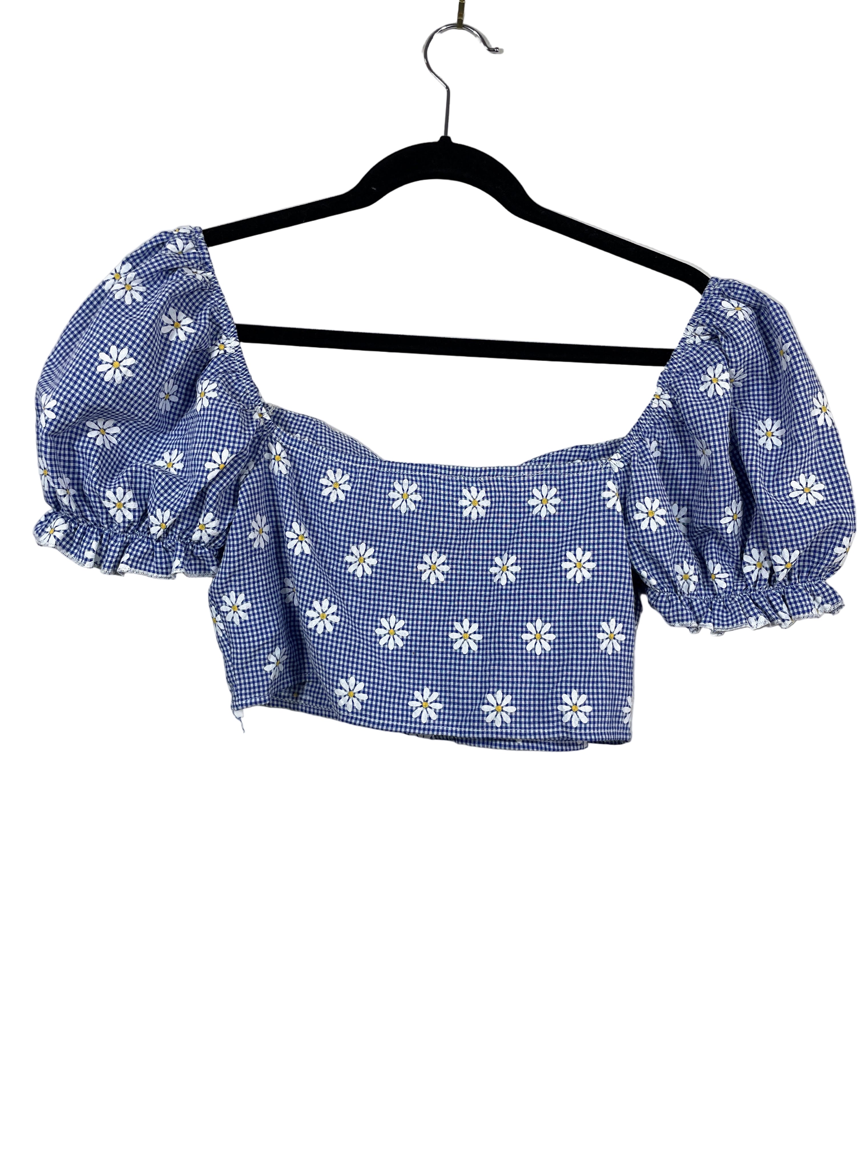 Blue and white checkered crop top with floral patterns on a hanger against a white background