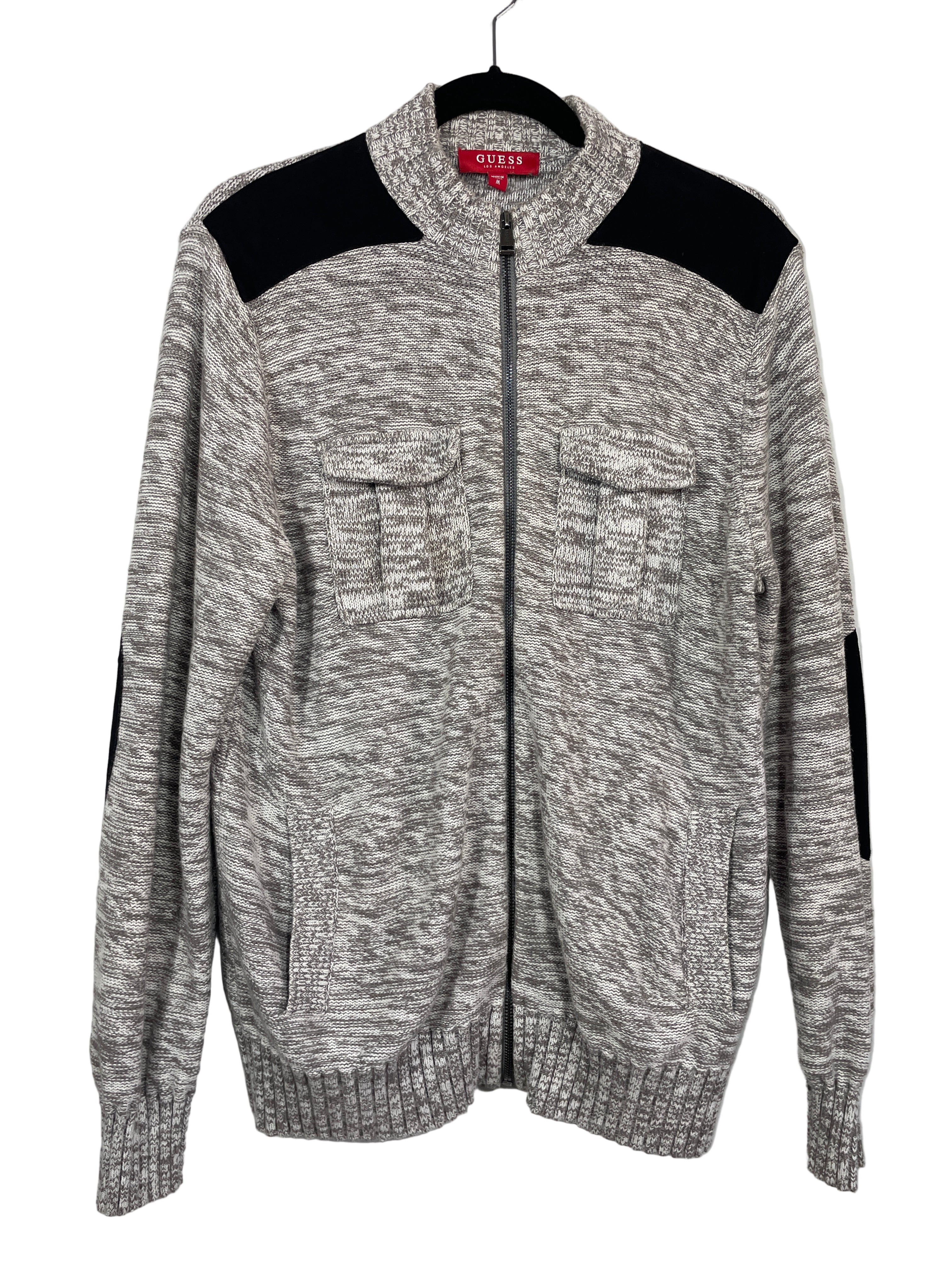 Front view of GUESS men’s grey marled zip-up cardigan with faux suede shoulders and chest pockets.
