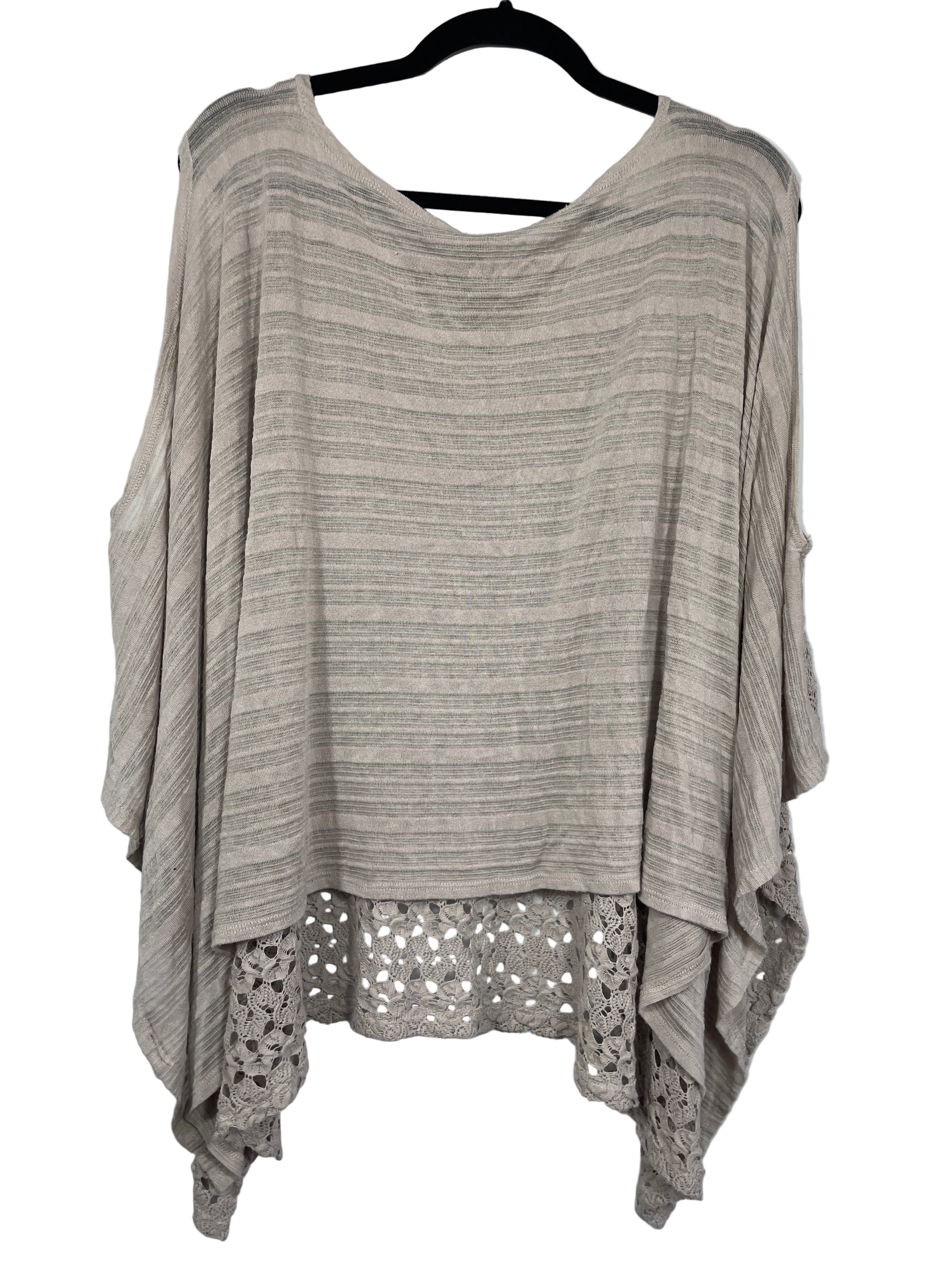 Back view showing light knit panel and layered hem detail of taupe West Kei blouse
