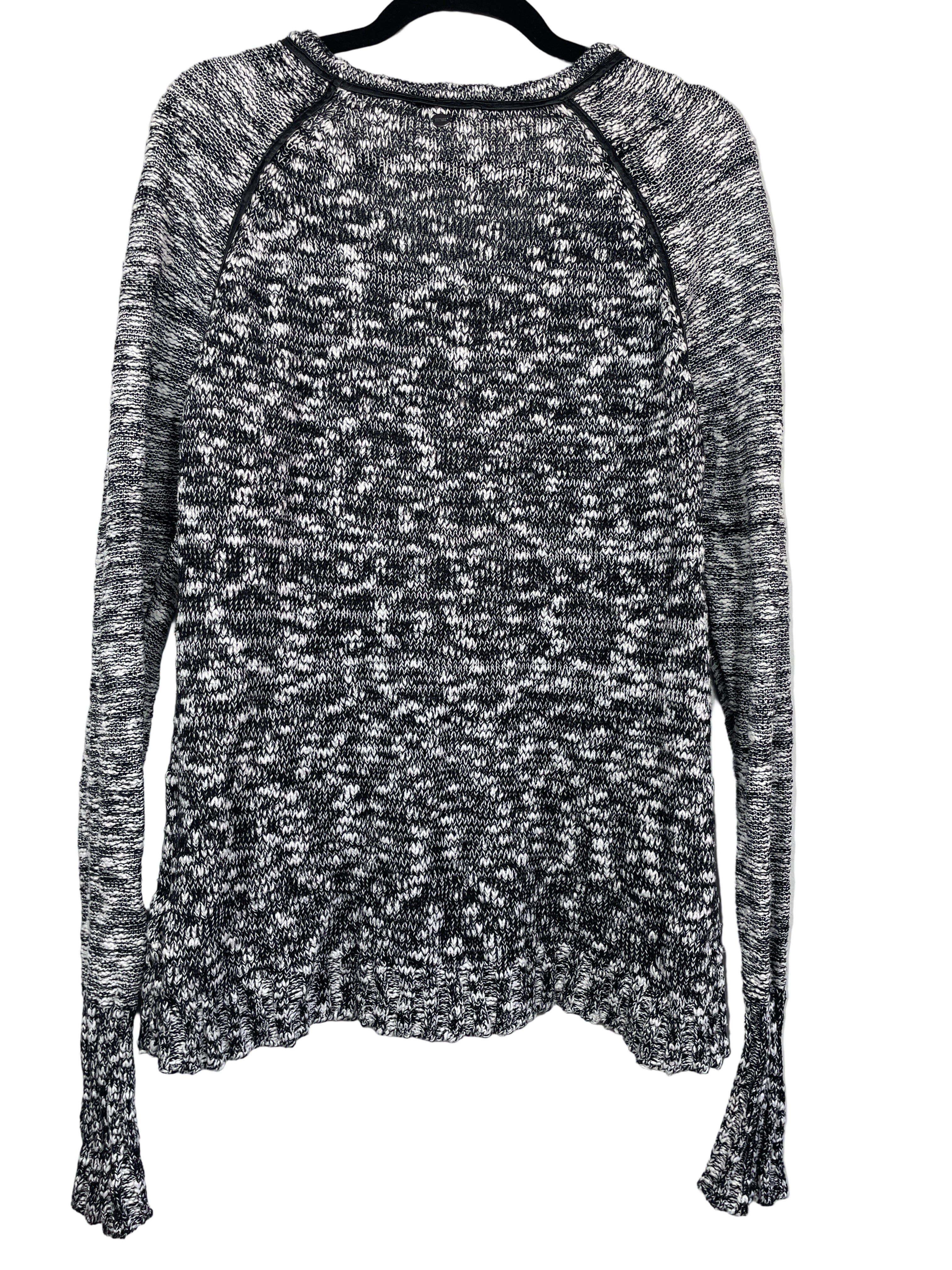 Back view of GUESS black and white cotton-blend knit sweater with ribbed hem and cuffs.
