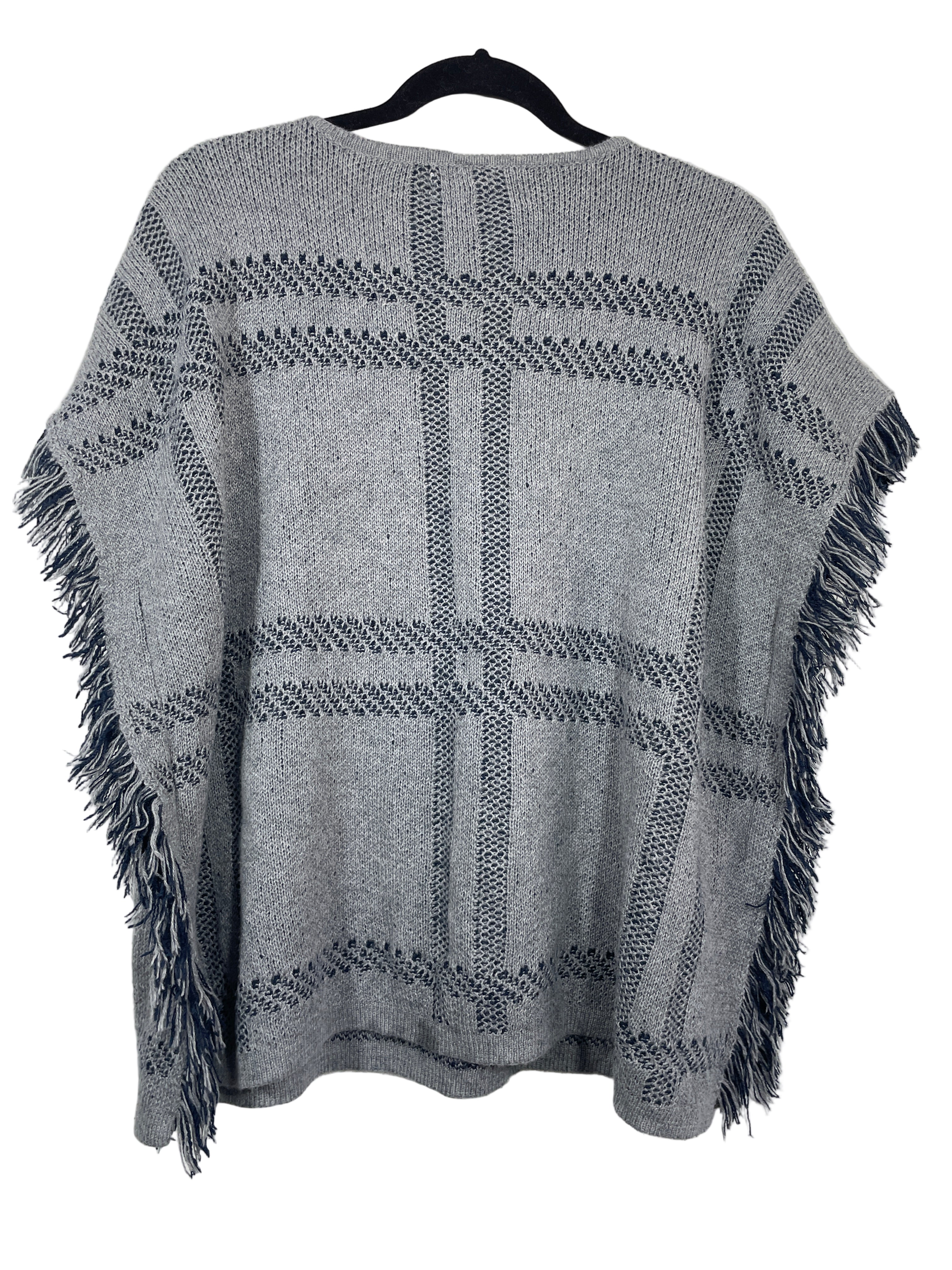 Back view of Old Navy poncho sweater showing full woven pattern and relaxed fit.
