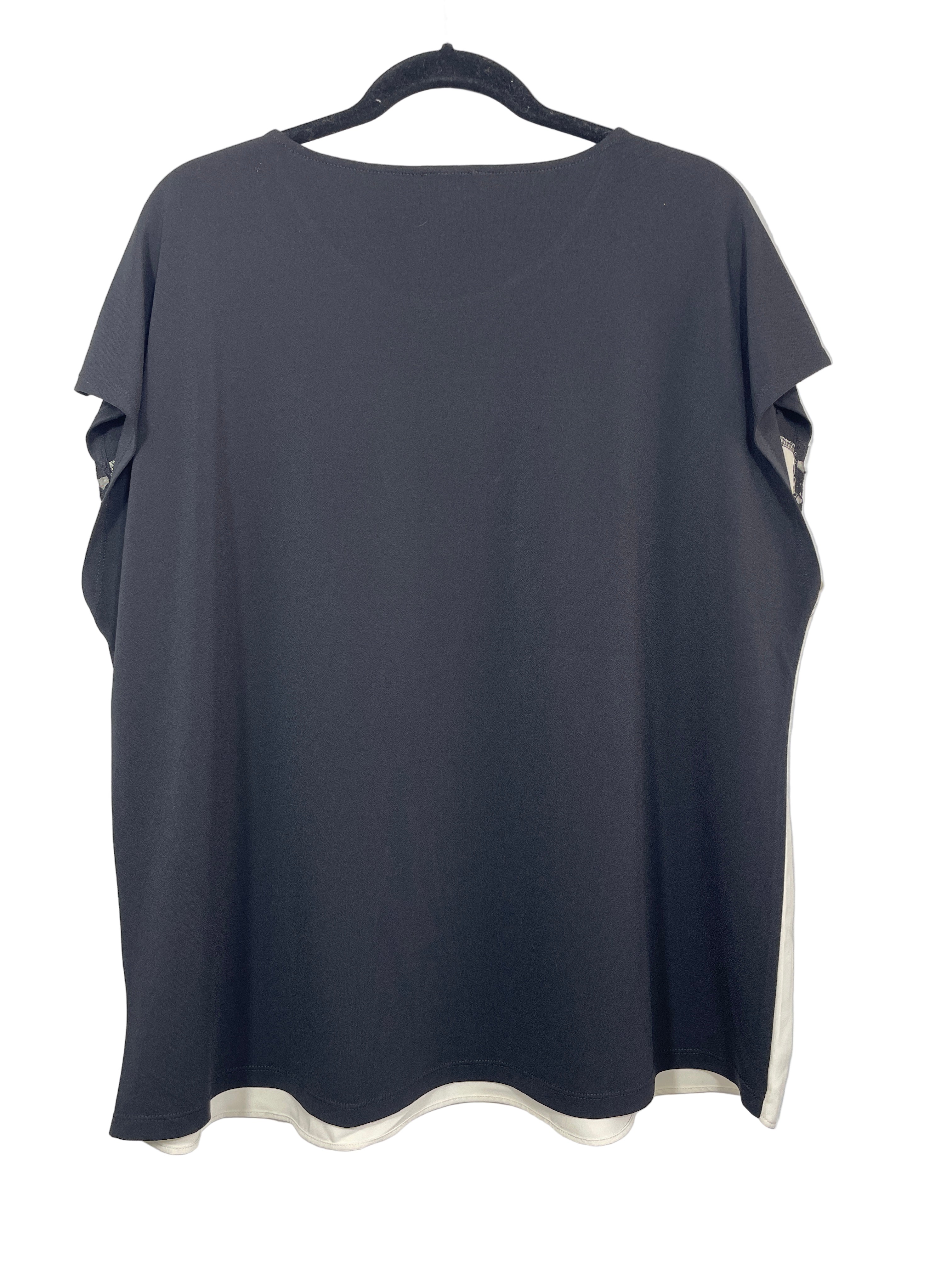 Laura Plus black and cream blouse back view showing solid black back panel and rounded hemline
