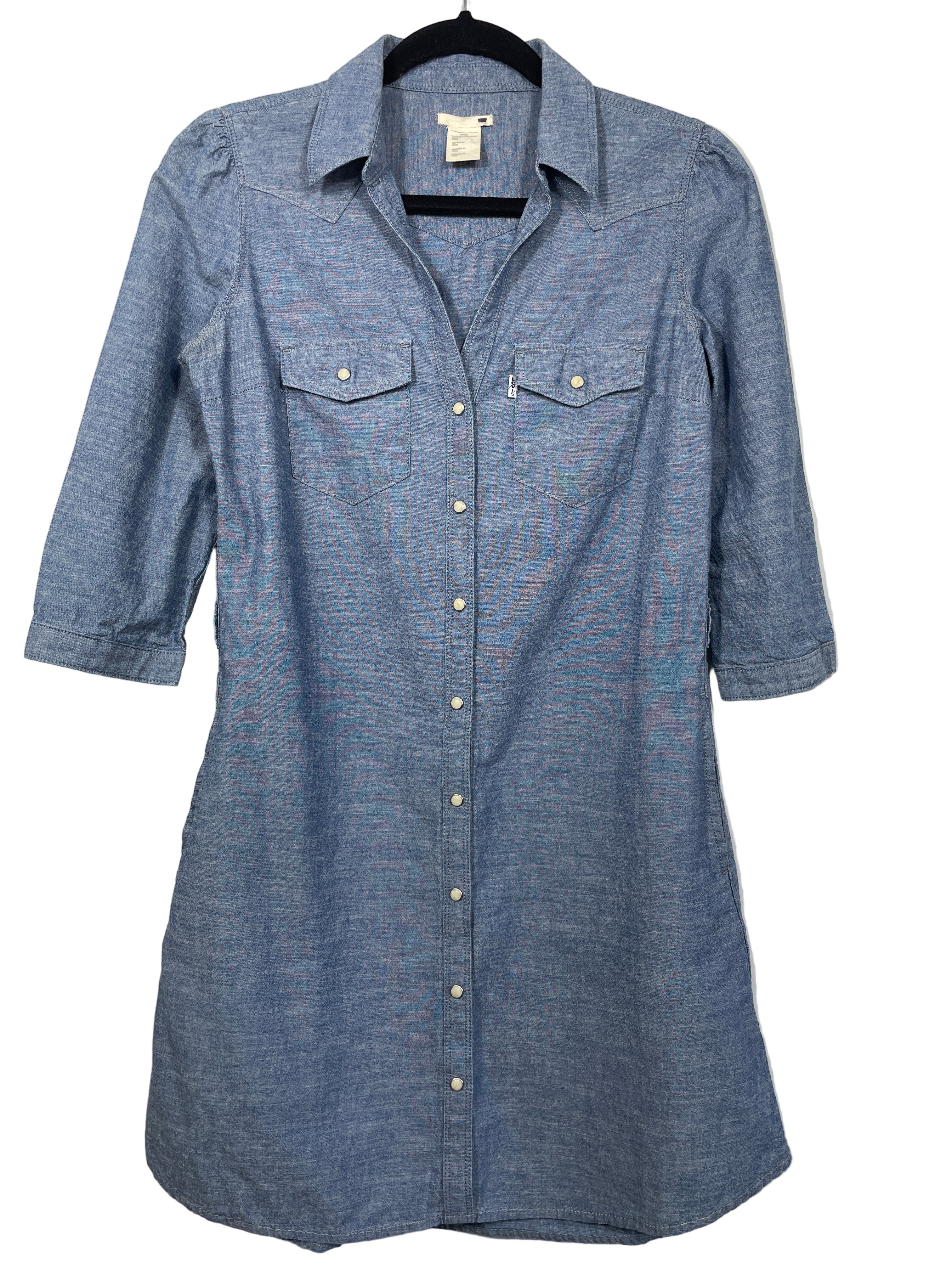 Levi’s lightweight denim shirt dress front view showing snap button closure, chest pockets, and collar
