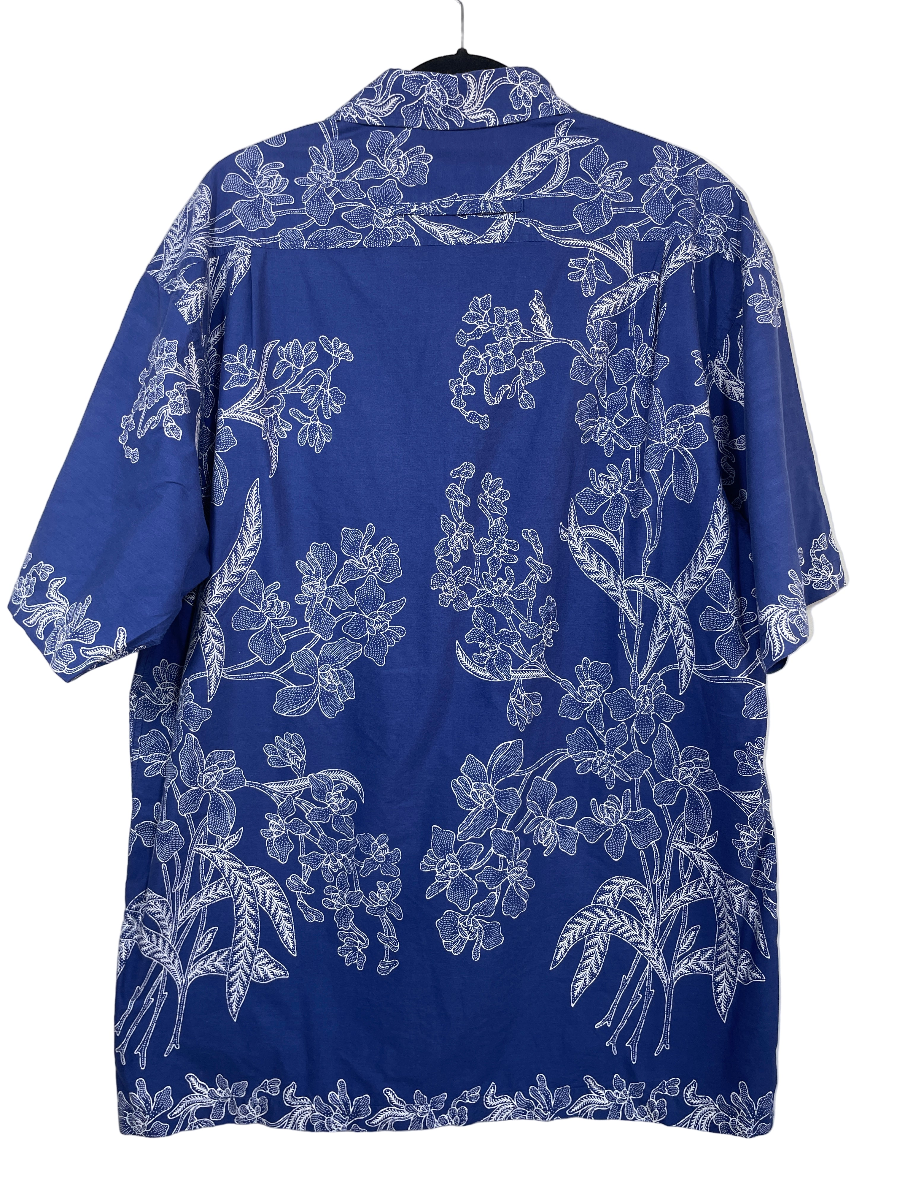 Unbranded blue Hawaiian short sleeve shirt back view showing full floral print across back panel
