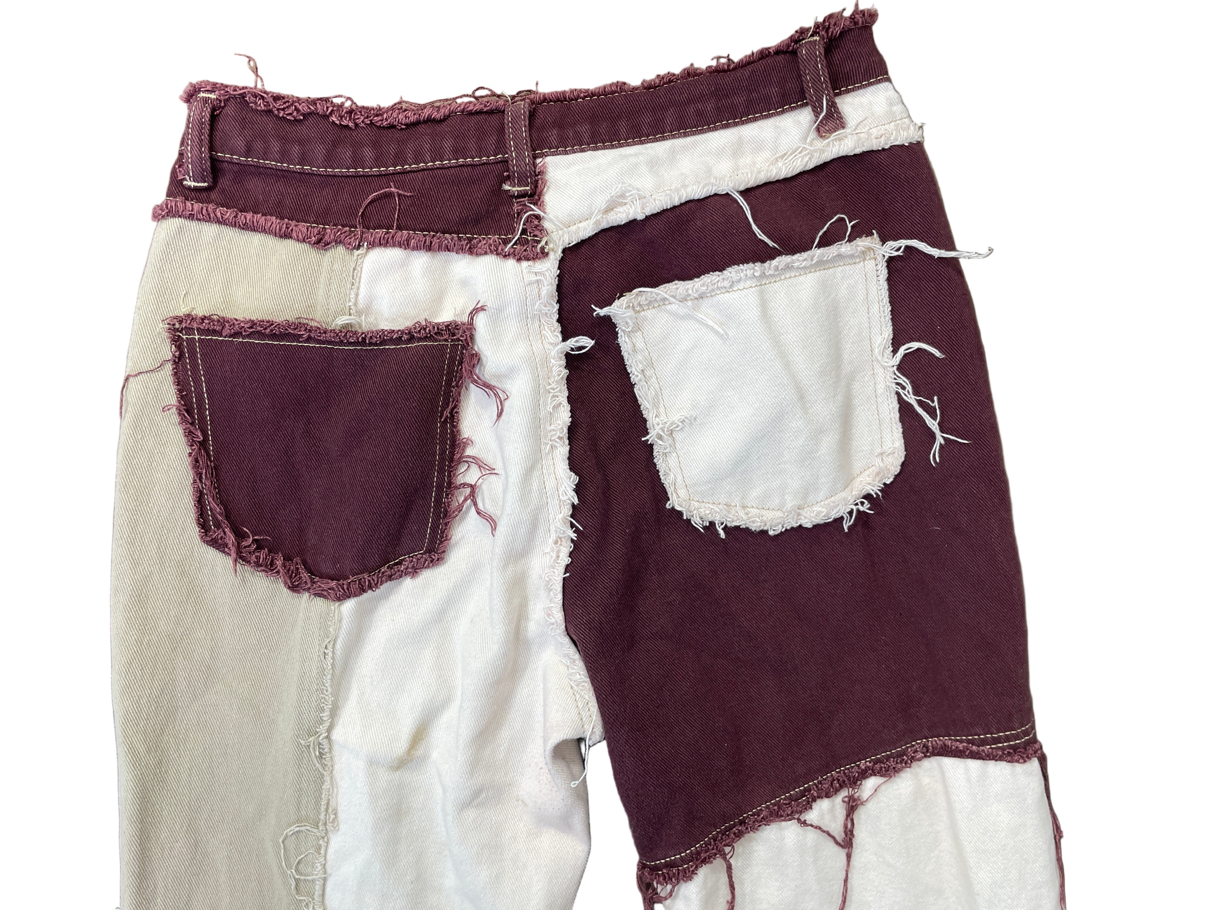 Back view showing dual-tone patch pockets and distressed seam work
