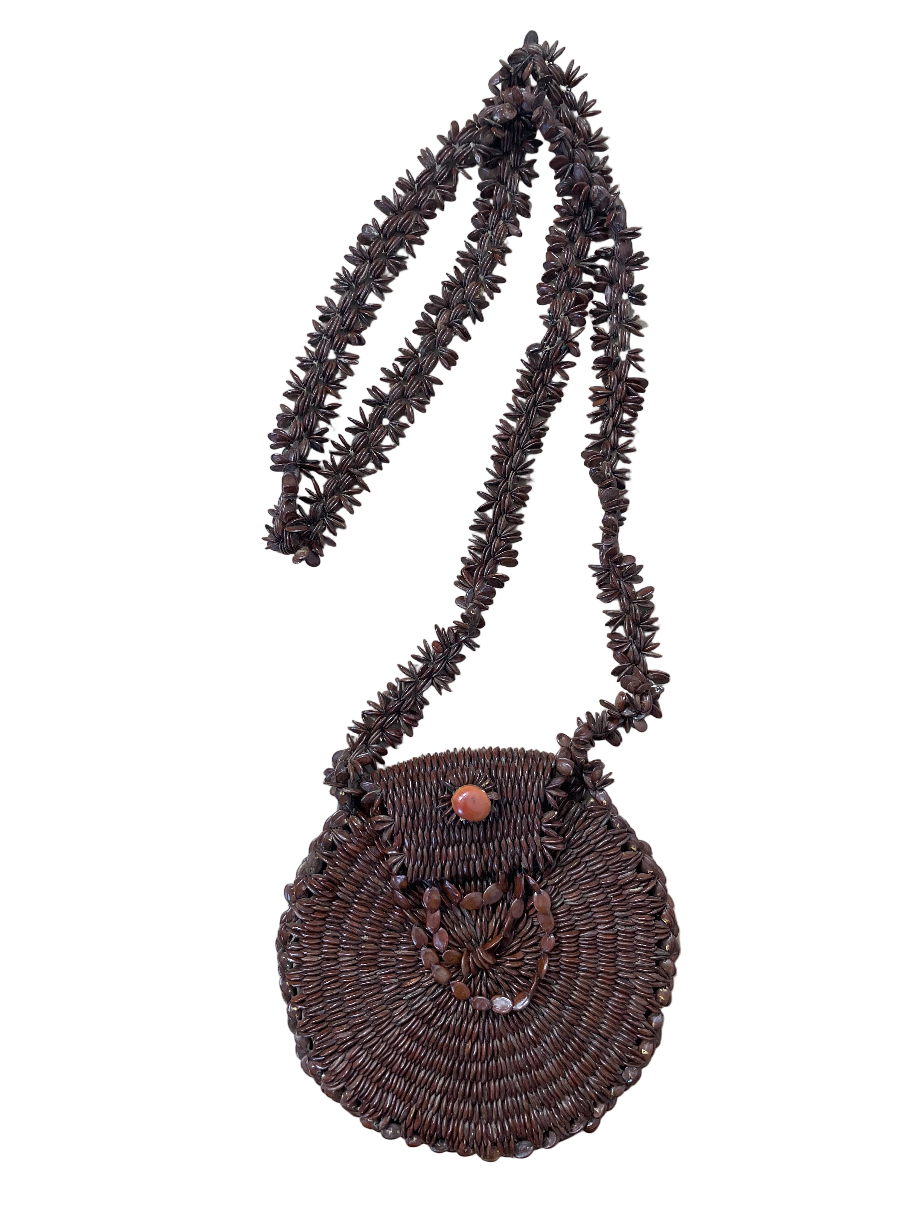 handwoven brown seed bead circular shoulder bag front view with flap and coral button closure