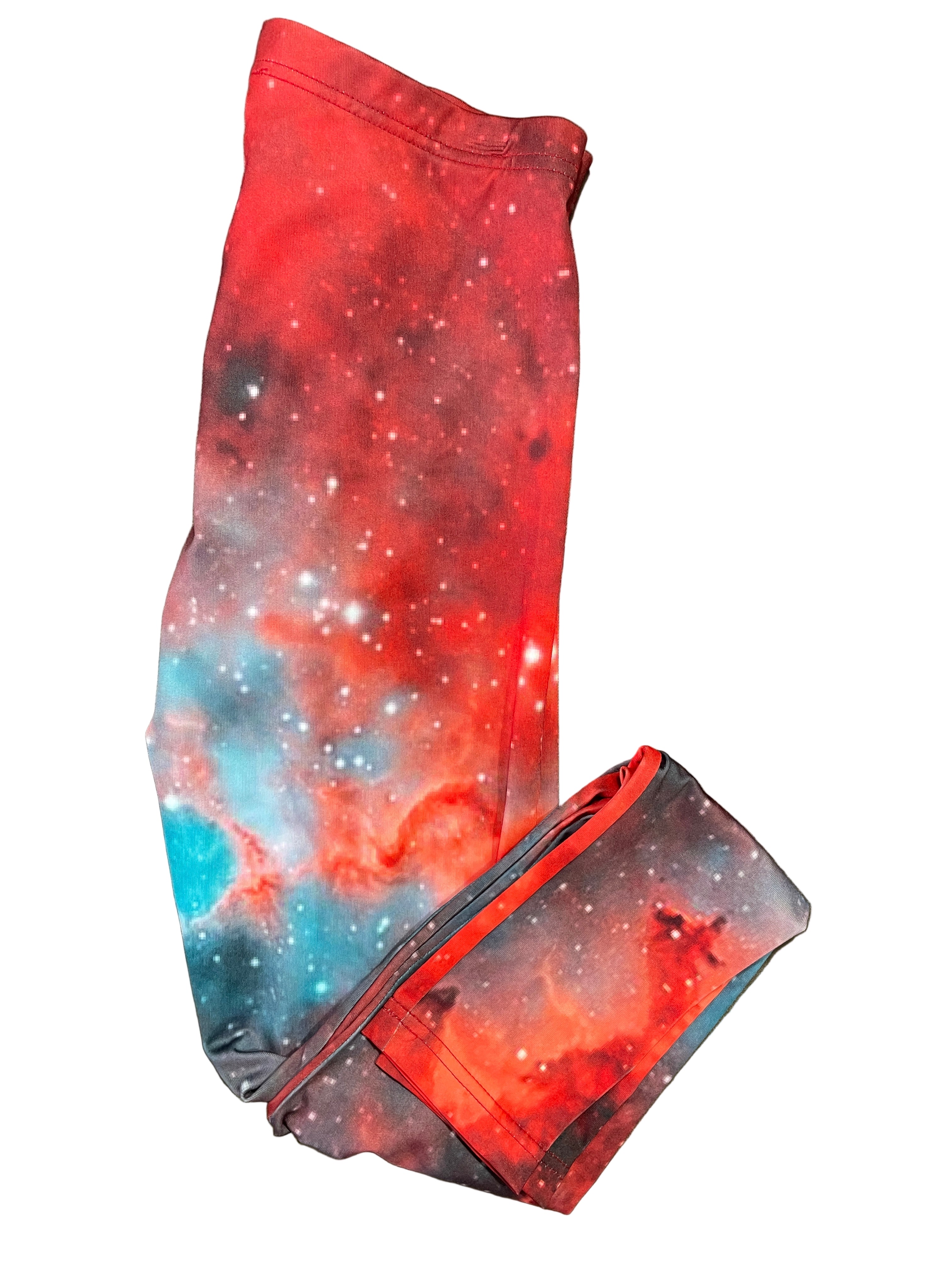 Folded view of Bishop galaxy leggings showing red and blue space print
