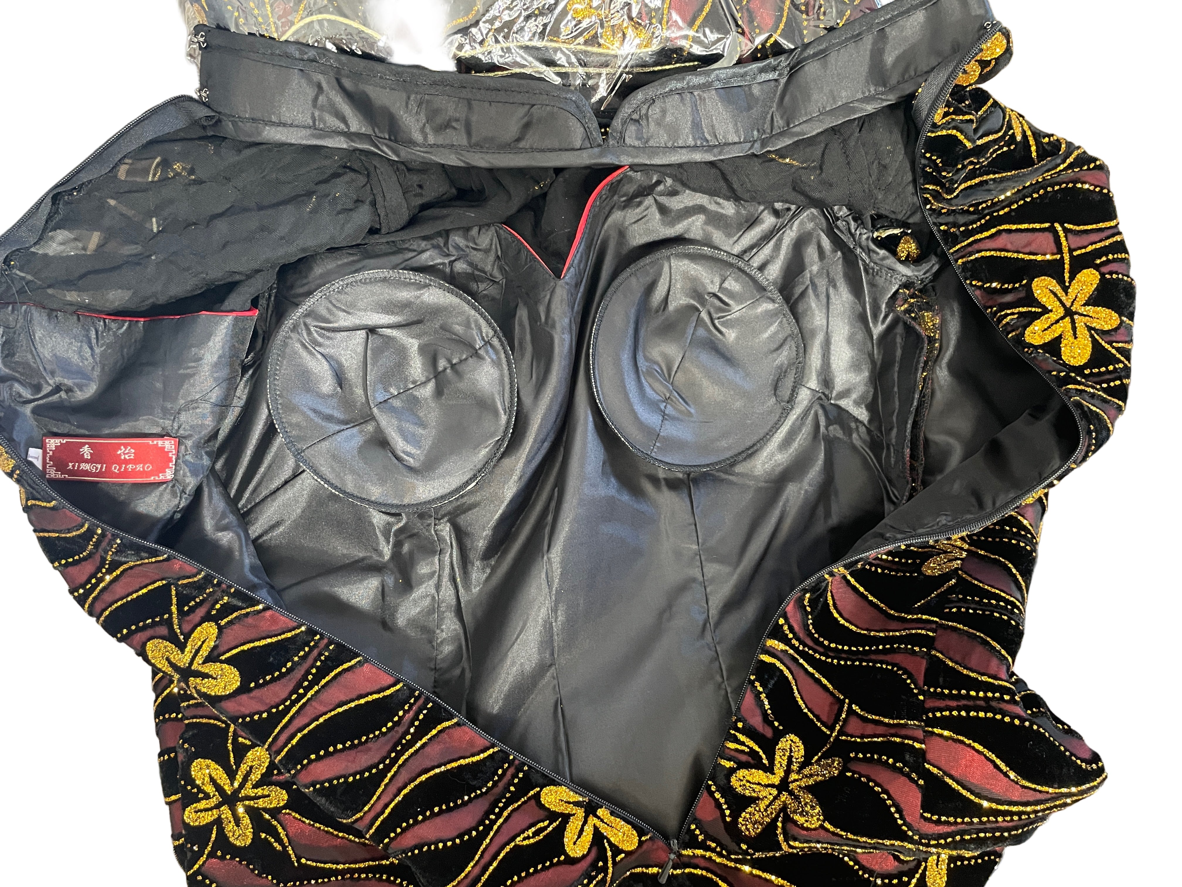Inside view of Xiangyi Qipao showing black lining and built-in bust support.
