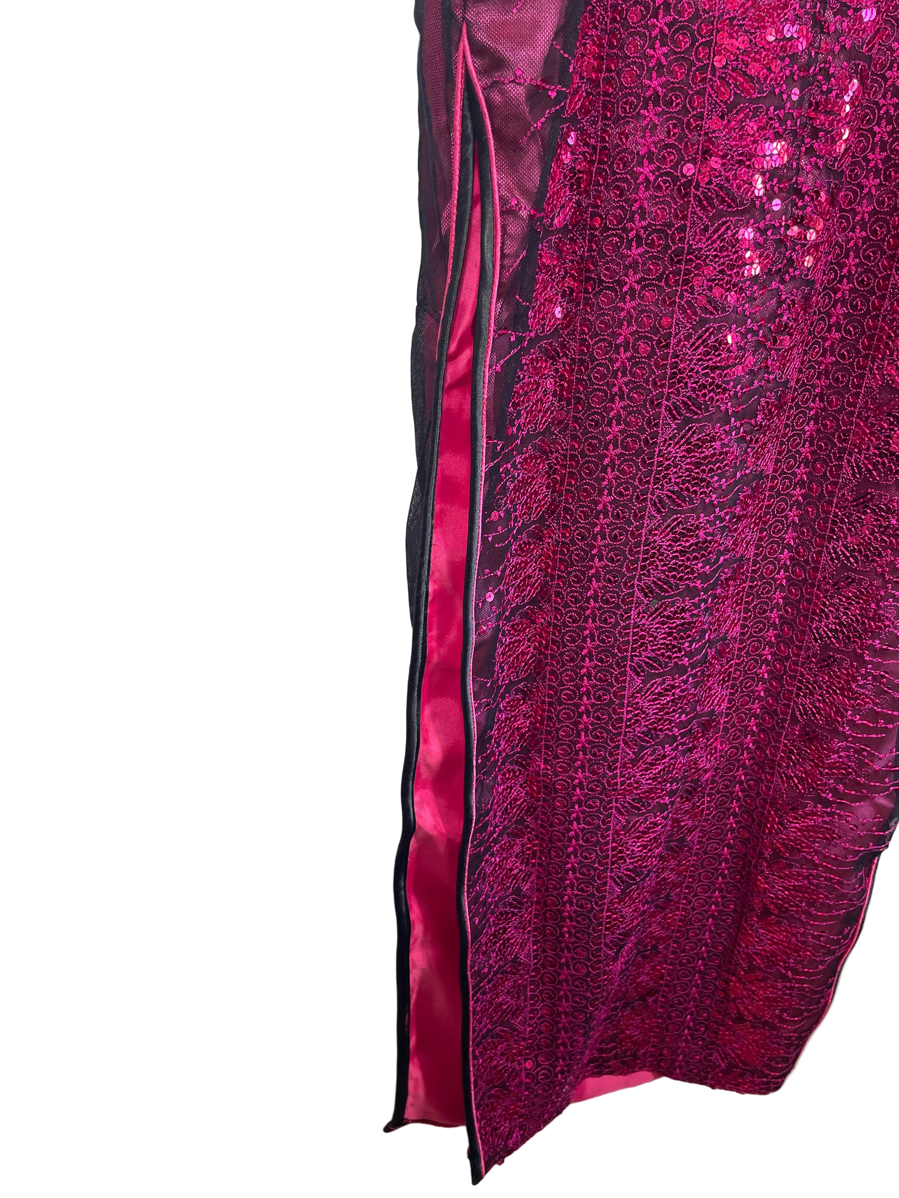 Side slit close-up showing satin-lined hem and embellishments.