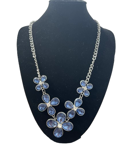 Blue floral statement necklace with faceted stones and silver-tone chain.