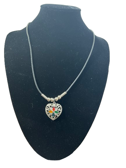 Silver-tone heart pendant on black cord choker, front view
