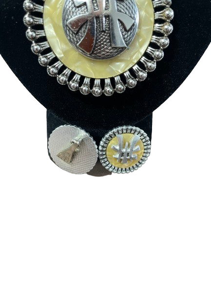 Set of silver and gold circular earrings on a black stand.