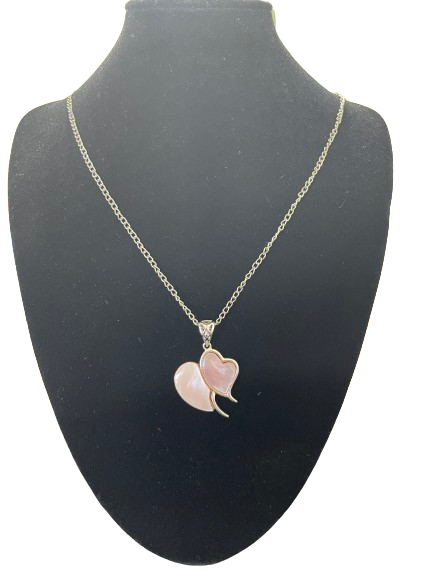 Rose quartz double heart pendant necklace on silver tone chain front view