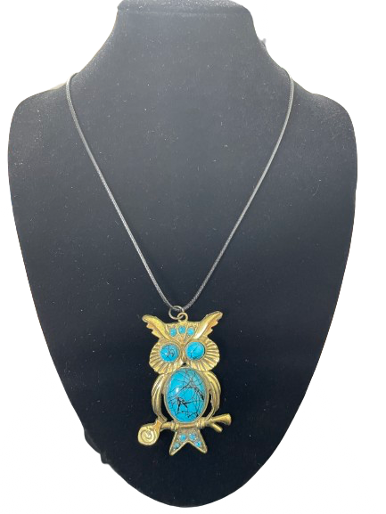 Gold-tone owl pendant necklace with turquoise-look stones front view