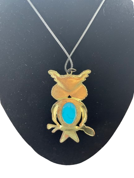 Owl pendant necklace showing smooth metal back