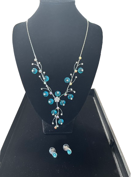 EBEN blue beaded rhinestone statement necklace and matching stud earrings displayed on black bust