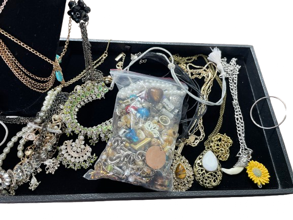 Bag of jewellery parts beads and broken pieces for crafts