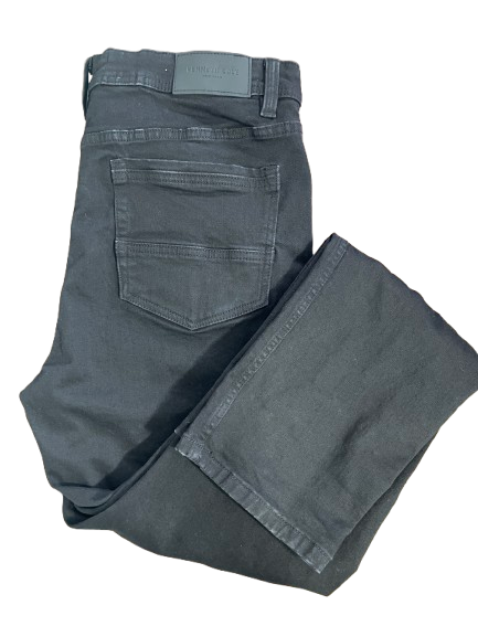 Flat lay of Kenneth Cole men's black athletic fit jeans showing back pockets and brand leather patch.
