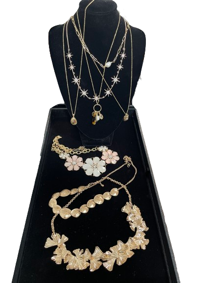 6-piece gold tone costume necklace collection with floral celestial and pendant styles