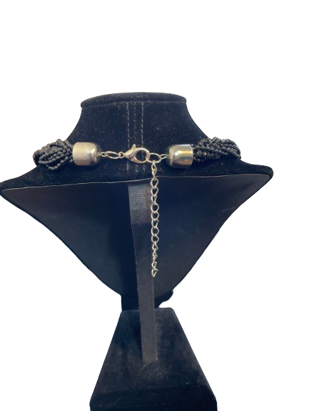 Unbranded black multi-strand seed bead necklace silver-tone lobster clasp and extension chain back view