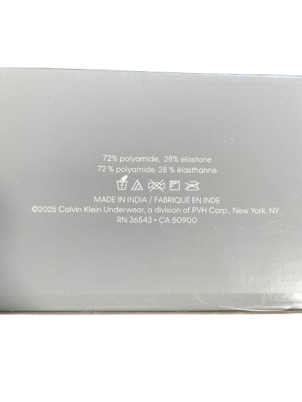 Close-up of the back of a Calvin Klein underwear box showing fabric composition and care symbols in white text on a light gray background.