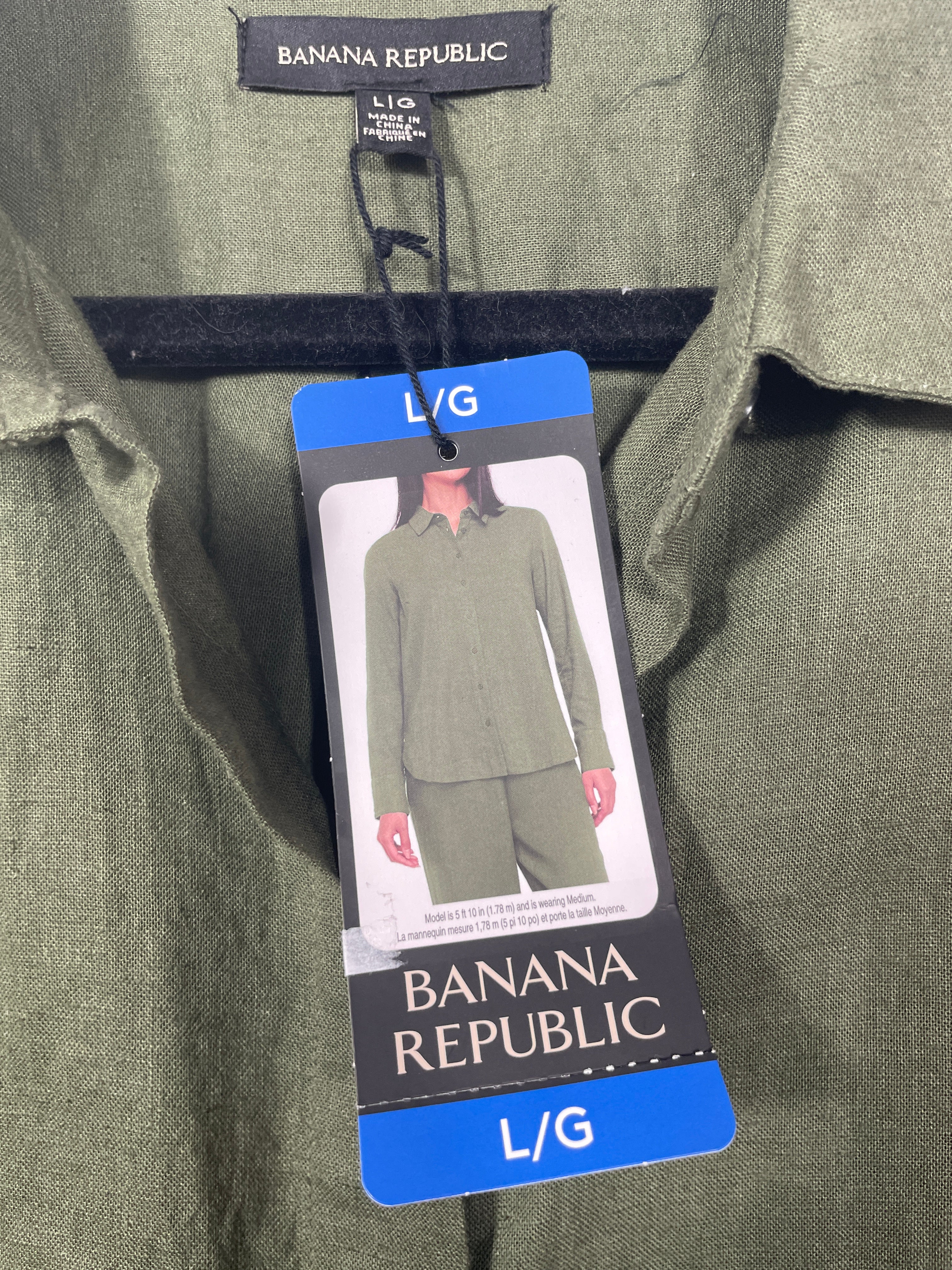 Close-up of an olive green Banana Republic collared shirt with a hanging size tag showing a model wearing the matching set.