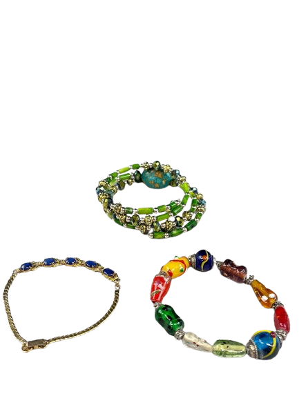 Set of colorful beaded bracelets on a white background