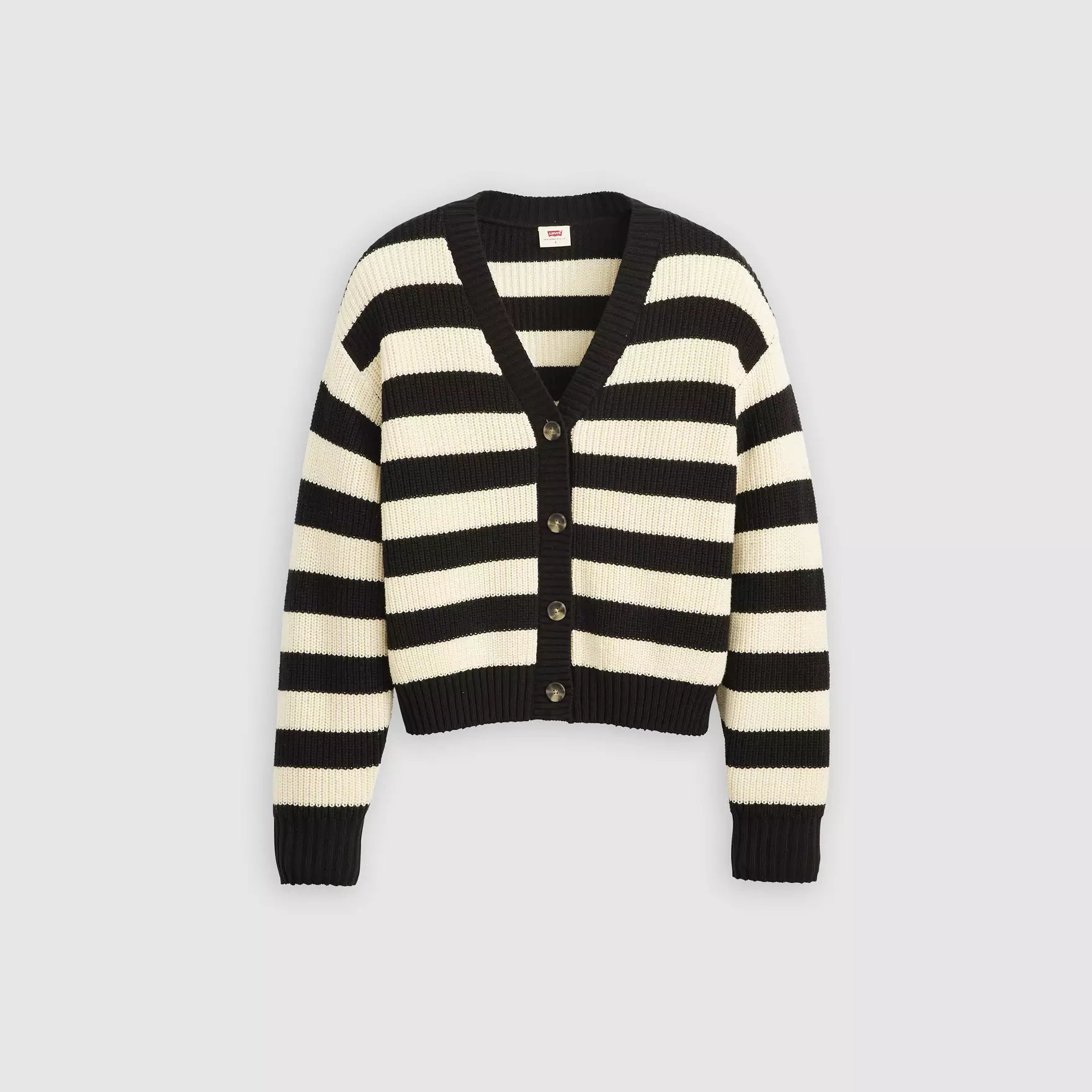 Black and cream striped cardigan on a light gray background