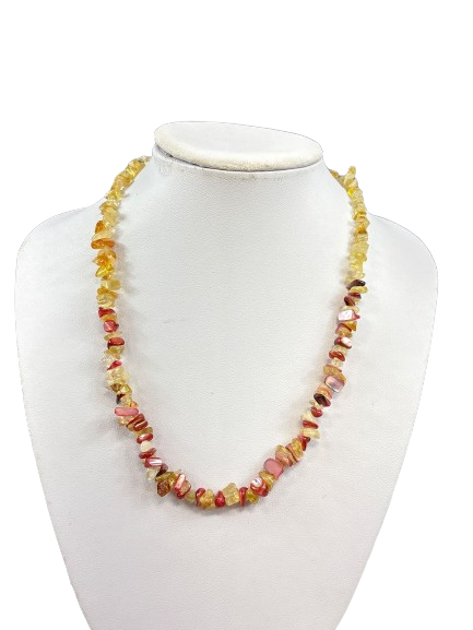 Citrine and pink chip gemstone necklace on display