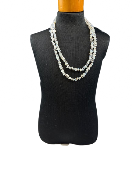 Long opalite bead necklace draped on bust